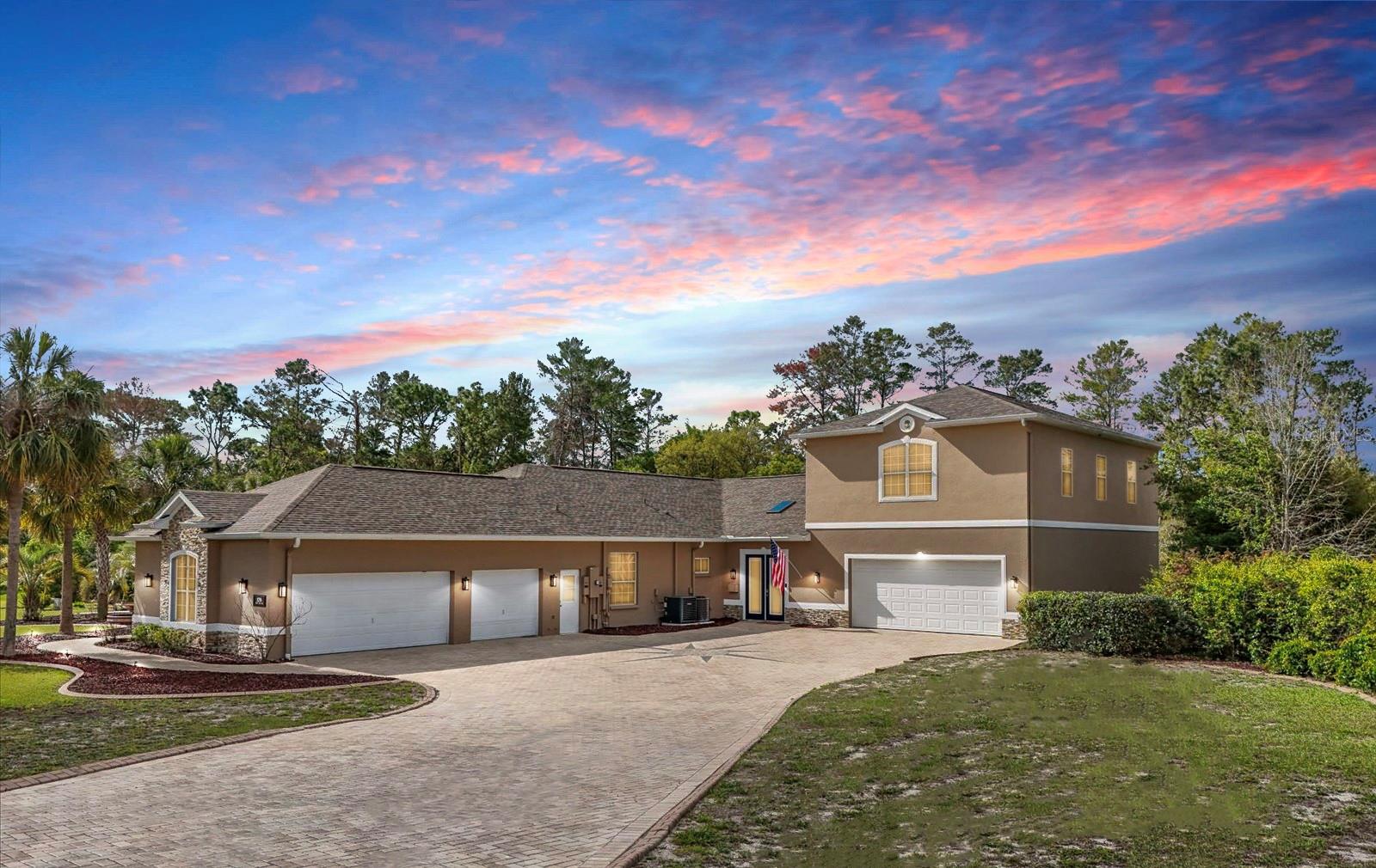 Discover your dream home—a breathtaking custom-built estate on nearly 1.5 acres, perfectly positioned on a premium corner lot in the heart of Weeki Wachee. This architectural masterpiece blends timeless elegance, modern functionality, and the vibrant Florida lifestyle, offering unparalleled space for family, friends, and unforgettable moments. **$14,000 Upgraded Kitchen with Brand New GE-CAFE appliances and new sink.**
Step inside to a thoughtfully designed layout featuring 5 spacious bedrooms, a dedicated home office, a state-of-the-art theater room, and an upstairs game room with a custom bar and private balcony. Whether hosting movie nights, savoring happy hour in your personal tavern, or working remotely in serene surroundings, this home delivers the perfect space for every occasion.
At its heart lies a stunning pavered courtyard, seamlessly connecting multiple rooms for effortless indoor-outdoor living. Dive into the sparkling saltwater pool with a cascading waterfall, or entertain at the outdoor kitchen, complete with granite countertops, a sink, mini-fridge, and ample storage—ideal for lively barbecues or tranquil evenings under the stars.
The recently (2025) upgraded chef’s kitchen is a culinary haven, boasting granite countertops, brand new GE Cafe appliances, new sink and faucet, including a double oven, and abundant counter space for meal prep and gatherings. Formal living and dining areas, adorned with tray ceilings, elegant columns, and crown molding, exude sophistication and charm.
Retreat to the luxurious primary suite on the main floor, featuring dual walk-in closets, tray ceilings, and a spa-inspired bathroom with a soaking tub and expansive walk-in shower. A private guest wing with two additional bedrooms and a full bath ensures comfort for visitors or extended family. All bedrooms are conveniently located on the main level for ease and accessibility.
Elevate your entertainment in the custom-built home theater, designed with a 150” screen, immersive dark ambiance, and a dedicated bar area. Upstairs, the private game room and bar steal the show, complete with wood cabinetry, granite counters, custom lighting, a second kitchen, and a retractable UHD 150” projection screen—perfect for game days, poker nights, or lively gatherings.
Additional highlights include a sprawling 6-car tandem garage with extra storage, a brand-new roof (2025), three A/C systems, two septic tanks, and two water heaters (all under 18 months old). Enjoy plantation shutters, crown molding, a new whole-home water treatment system, and a walk-in Fort Knox safe for ultimate peace of mind.
Nestled in a sought-after community known for spacious lots and serene surroundings, this estate places you moments from Florida’s Nature Coast treasures: just 3 miles from Weeki Wachee Springs, 8 miles from Bayport’s breathtaking Gulf sunsets, and a short drive to Homosassa Springs for outdoor adventures. With easy access to Tampa and Orlando, world-class dining, shopping, sports, entertainment, and international airports are always within reach.
This extraordinary property redefines luxury, offering unrivaled privacy, space, and the essence of Florida living. Schedule your private tour today and experience this masterpiece for yourself!