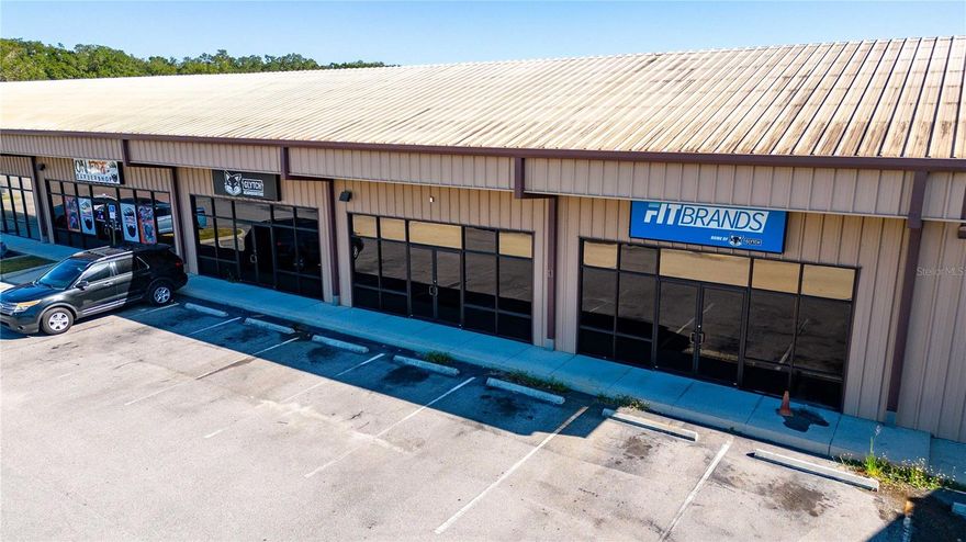 Excellent well maintained COMMERCIAL/RETAIL/PROFESSIONAL OFFICE units available in an updated and remodeled commercial strip center located at the intersection of Eiland Blvd and Fort King Rd in Zephyrhills.  Zoned C2 in the City of Zephyrhills jurisdiction for a variety of business uses.  Features of each unit include a large glass storefront, high ceilings, concrete flooring, rear staff access,  ADA compliant restroom.  Pylon and building signage slots available to advertise your business.  Common area parking with plenty of parking slots. Excellent access from both the north and south end of the center.  Water, trash, and grounds care included with rent! Unit 2 (approx 1,222 sq ft) offered at $15 psf ($1,527.50 monthly excluding sales tax).  Unit 3 (approx 1,320 sq ft) offered at $18 psf ($1,980.00 monthly excluding sales tax).  Both units (total of 2,542 sq ft) if taken simultaneously offered at $14 psf ($2,965.67 monthly excluding sales tax).  Units currently connect in interior however will be split if need be.  Rent one or the other, or take both units for an overall discount! A great opportunity to put your business in a well kept commercial center with low rental costs!  Available now! Call today!