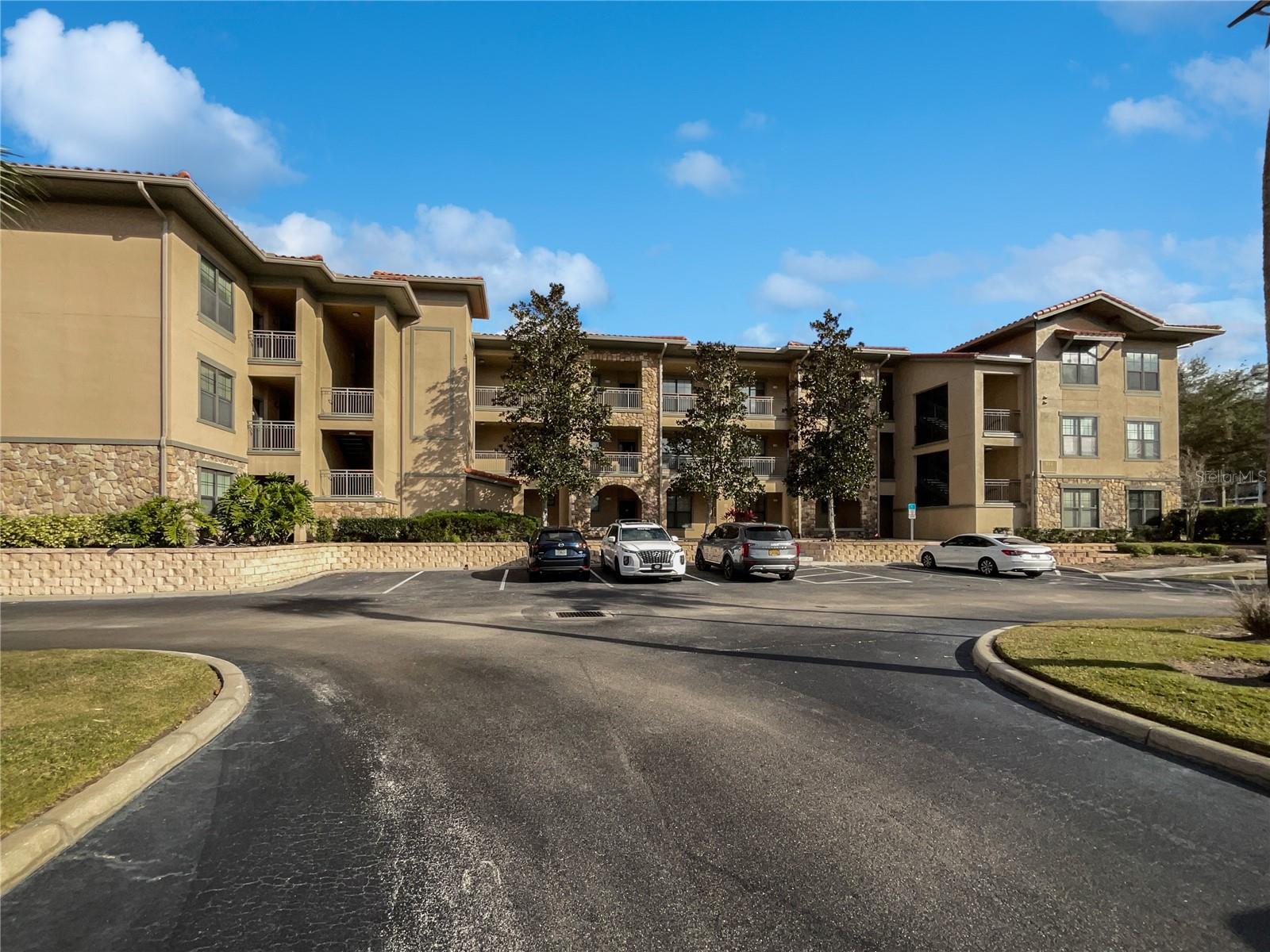 One or more photo(s) has been virtually staged. Welcome to Bella Piazza! This stunning 3-bedroom, 3-bathroom condominium offers the perfect blend of style, comfort, and convenience in one of the area’s most desirable communities. Enjoy a truly carefree lifestyle with ground maintenance included, plus access to a host of resort-style amenities including a clubhouse, fitness center, children’s splash pad, and two sparkling community pools. Bella Piazza is also zoned for short-term rentals, making it a fantastic investment opportunity. HOA fees cover water, trash, internet, and cable for added peace of mind. Inside, you’ll be impressed by the spacious, open-concept layout. The large kitchen features granite countertops, abundant cabinetry, and a breakfast bar for casual dining or extra seating. The adjoining living and dining area creates the perfect space for entertaining family and friends. Step through the rear French doors to a generous private porch—ideal for enjoying your morning coffee or relaxing with an evening drink. The large primary suite offers rear patio access, a large walk-in closet, and a luxurious en-suite bathroom with a soaking tub, walk-in shower, and a dual vanity sink. An additional bedroom also features its own private en-suite bathroom, perfect for guests. This prime location is close to Berry Town Center, Disney theme parks, shopping, dining, entertainment, and major highways including I-4 and 429. Orlando International Airport is only 30 minutes away. Don’t miss your chance to own this beautiful home—schedule your private showing today!