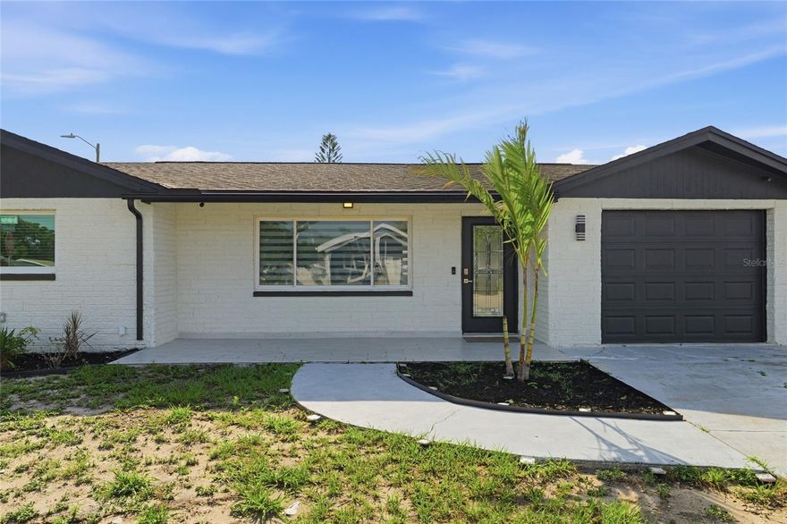 MOVE IN READY in Port Richey*** Beautifully updated 3-bedroom, 2-bath home located in the heart of Port Richey! This move-in ready property features an open floor concept with modern lighting, fresh interior and exterior paint, and a spacious enclosed screened porch perfect for relaxing or entertaining with additional storage shed. Corner lot property with ample backyard space for a potential pool or parking space for trailer or boat. Major updates include NEW A/C and ductwork (2022), refrigerator, stove, microwave, and water heater Tankless replaced in (2022), and roof replaced in 2017. All windows include blinds for added privacy and convenience.  The property is connected to public water and also includes a private well on the side of the garage that needs the electrical connection and pump installation. Not in Flooding Zone. Conveniently located near US-19, shopping, restaurants, medical facilities, and just a short drive to Weeki Wachee Springs and Gulf Coast beaches. Don’t miss this great opportunity to own a beautifully maintained Florida home!