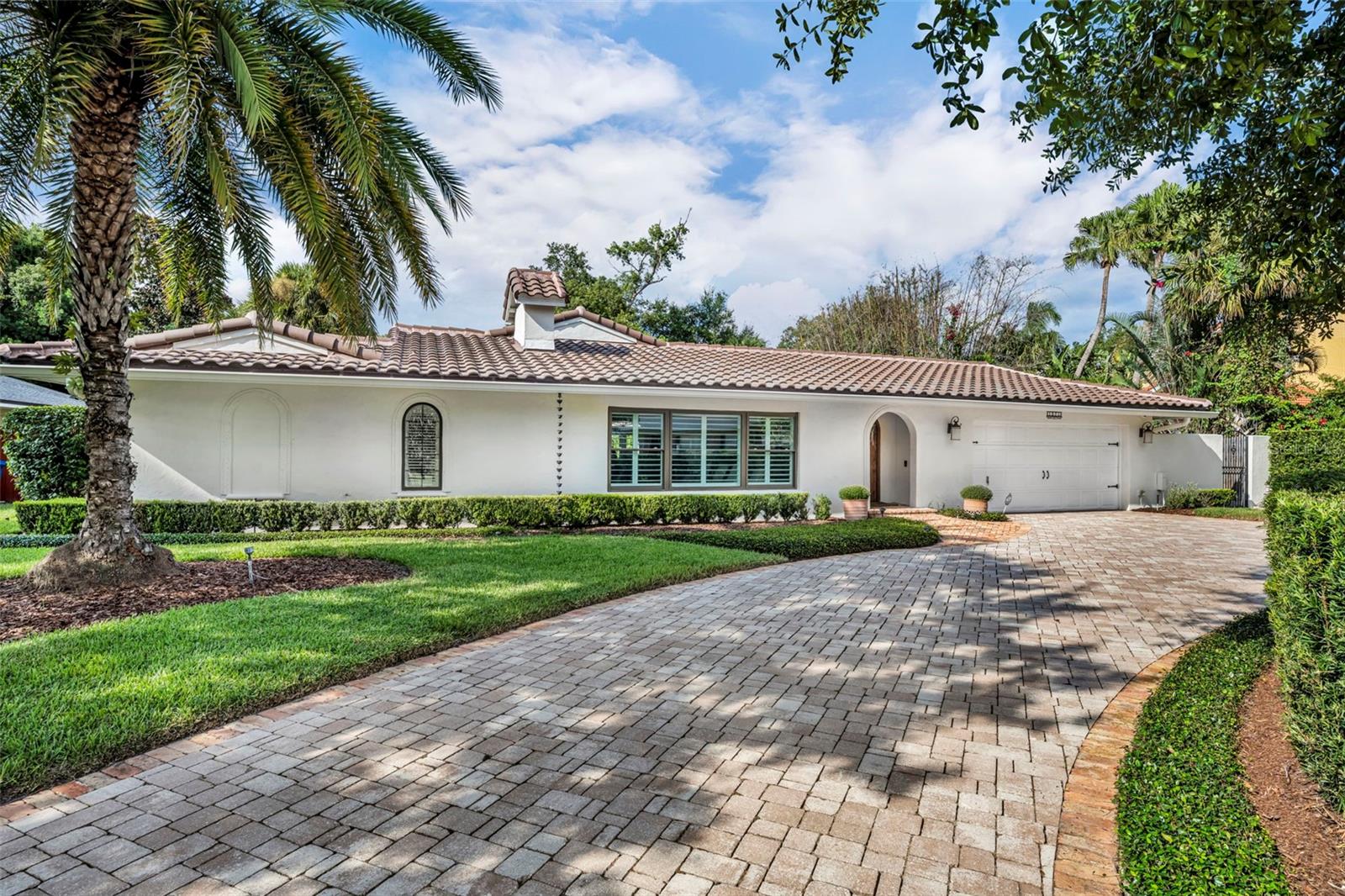 Don’t miss the opportunity to live in one of Winter Park’s most desirable neighborhoods. Nestled on a charming, tree-lined brick street, this meticulously updated 4-bedroom, 3-bath home exudes elegance and style, offering ample space for family comfort as well as areas to relax and entertain. This impressive property has been fully renovated and is truly move-in ready. From the moment you arrive, you'll be captivated by the charming exterior and lush landscaping on a spacious .32acre lot. Inside, you'll find a bright, sophisticated home featuring beautiful hardwood floors throughout, tons of windows accented with plantation shutters, and exquisite handcrafted details. The front family room features a wood-burning fireplace, creating a comfortable space for binge-watching Netflix or Sunday NFL games, unwinding with a good book, sharing wine with friends, or hosting elegant dinner parties in the dining area. The light and bright chef’s kitchen is a culinary dream that offers a generous layout with abundant wood cabinetry, gleaming granite and gorgeous wood countertops, a large prep island with seating for four, state-of-the-art Thermador stainless steel appliances including a 6-burner professional oven, and an inviting sitting nook, capped off by a dramatic cathedral ceiling and windows that overlook the lush back yard. On one side of the home are three generously sized bedrooms with ample closet space and two full bathrooms with gorgeous custom tile and flooring. On the other side of the home awaits a true retreat: the private Primary Suite, a sanctuary equipped with a spacious bedroom, sitting area, walk-in custom closet, and a luxurious spa-inspired bath with stunning porcelain tile flooring, a large dual sink vanity, an oversized walk-in shower, and a separate water closet. Step outside to experience the quintessential Florida lifestyle in the private backyard oasis, complete with a beautiful sparkling saltwater pool, a spacious patio, and professionally landscaped grounds — ideal for entertaining year-round. Additional features include a convenient laundry/mudroom with storage for backpacks and gear, abundant closet space, a water softener, and a two-car garage with storage cabinets and shelves. Improvements include updated electrical, plumbing, and ductwork, plus a brand new tile roof (2023). This remarkable property is located close to Winter Park’s renowned Park Avenue shopping, premier restaurants, the area’s top-rated schools, and also close to Interlachen Country Club and the Winter Park Racquet Club. This exceptional property won’t last. See for yourself why this gorgeous house should be the place you call home. Schedule your showing today.