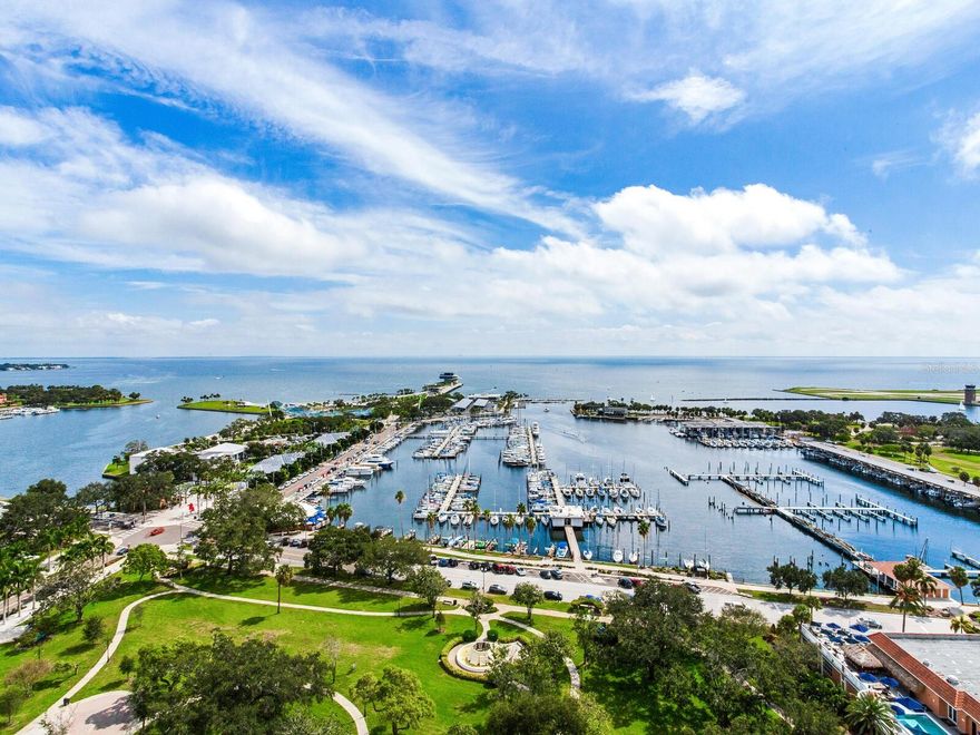 HIGH AND DRY NO STORM DAMAGE STUNNING LUXURY DOWNTOWN CONDO WITH UNMATCHED PANORAMIC VIEWS OF TAMPA BAY AND THE PIER. A rare opportunity to own one of the premier residences in St. Petersburg, this 20th floor condo in the exclusive Florencia boasts one of the best views in the city. This 3 bedroom, 3 ½ bathroom condo of 2,758 sq ft (AC) has undergone a sophisticated designer remodel with a modern flare, custom cabinets and immaculate luxury finishes throughout. As you enter this unique residence your eyes will be immediately drawn across the great room to the wall of huge picture windows framing breath-taking views of Tampa Bay, the pier and the city. The wall of windows bathes the entire great room with natural light creating an inviting and airy feeling to this expansive room. Large enough for multiple seating areas, a formal dining area, breakfast area and large chef’s kitchen, the great room provides true open-concept living. Two beautiful waterfront terraces flank each end of the great room providing additional living and entertaining space. The custom kitchen will inspire any chef with Miele steam-oven, Miele induction cooktop, Sub-Zero refrigerator, an abundance of custom cabinets and walk-in pantry. The large two-toned, two-tiered island with dining area and wine refrigerator is center stage for entertaining and dining events. Each morning will be a joy with an expresso from the built-in Miele espresso maker sipped on one of the terraces watching a magnificent sunrise over the calm Tampa Bay waters. Off the great room is an interior space perfect for a media room or spacious home office. The premiere bedroom suite is truly a romantic retreat. The expansive bedroom opens to one of the waterfront terraces providing amazing open water views. Two walk-in closets provide plenty of custom storage. The en suite bathroom will impress like a high-end spa with long counters, custom cabinets, dual sinks, dual shower-head shower and electric TOTO toilet. Family and guests will truly enjoy their stay with two guest bedroom suites at opposite ends of the condo, each enjoying full bathrooms and open water and city views. Off the impressive foyer is a magnificently designed powder room fit for the pages of an interior design magazine. A separate laundry room, two storage/utility rooms (one inside the unit and one just outside), hurricane shutters for the terrace sliders, electric window shades, and reverse-osmosis water filtration system round off the interior features of this amazing residence. This luxury property also comes with two secured garage parking spaces with EV charger and climate controlled storage locker. The Florencia is a 48 residential unit building with a luxury boutique hotel feeling. Catering to those desiring elegance and privacy, this stunning property has amenities rivalling those of much larger buildings including a heated pool and spa, fully equipped fitness center, social room with billiards, on-site manager and concierge service. Perfectly situated in the heart of downtown, this amazing residence is just steps from world-class parks, museums, restaurants, entertainment and shopping. Make an appointment to tour this incredible residence today!