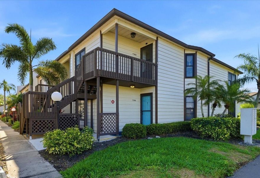 Wake up just steps from the sparkling community pool in this bright, turnkey-furnished first-floor corner condo with a NEW A/C (2025), located in the welcoming 55+ community of Country Village. The corner location brings in extra natural light, while the ground-floor setting offers easy everyday living just outside your door. Inside, the dining area opens to a spacious living room that becomes the home’s main gathering space—perfect for relaxing evenings, visiting with friends, or simply enjoying the day-to-day rhythm of home. The kitchen features abundant cabinetry, a large pass-through that keeps it connected to the dining area, and a sunny breakfast nook for casual meals and everyday routine. Sliding glass doors from the living room open to the screened lanai, where you can enjoy the fresh Florida air and peaceful green surroundings. The split bedroom layout offers comfortable separation between spaces. The primary suite provides generous room to unwind along with an en suite bathroom with walk-in shower, while the second bedroom and full guest bath offer flexible space for visitors, hobbies, or a home office. Residents enjoy beautifully maintained grounds, cable and internet service, exterior pest control, and roof care, along with community amenities that include a sparkling pool and spa, shuffleboard courts, and inviting gathering spaces for social events and laid-back afternoons. Just minutes from some of Florida’s most breathtaking Gulf beaches, this location also places shopping, dining, and entertainment within easy reach—making it simple to enjoy everything the Gulf Coast lifestyle is known for.