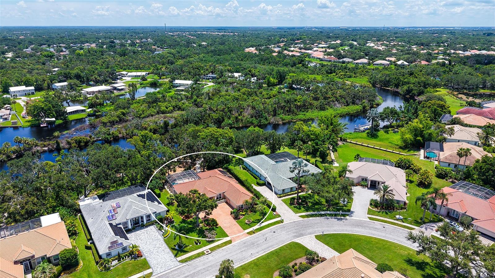 STILLWATER… by the RIVER. Tucked away on a serene half-acre lot along the Braden River, this RIVERFRONT pool home in highly desirable Mote Ranch offers a truly one-of-a-kind setting. Surrounded by lush natural beauty and Old Florida charm with mature landscaping. A private boat dock and a boat lift, this property is perfect for kayaking, paddleboarding, fishing, or simply enjoying the riverfront views right from your backyard. Enter double doors into over 2,700 SF of thoughtfully designed living space. An open, inviting floor plan with high ceilings and wood-look vinyl flooring throughout. Large sliding glass doors in the formal living room open to the huge lanai and solar-heated pool with the peaceful river beyond. The spacious kitchen includes stainless steel appliances, abundant cabinetry & counter space, built-in desk, and a cozy breakfast nook with a large aquarium window. The large family room opens to lanai, a formal dining room offers additional space for entertaining. The split-bedroom layout features a generous primary suite with private access to the lanai, a large walk-in closet, and an ensuite bath with dual vanities, soaking tub, and a walk-in shower. Two additional bedrooms share a full bath. A mudroom leads to an oversized laundry room with built-in cabinetry, utility sink, and space ideal for crafts, sewing, or a home office. The 3-car garage is split, 2 car side entry with large paver driveway and 1 car facing the side yard, great to store your boating equipment, an exercise room or workshop, or golf cart parking… newly installed epoxy flooring in garages. Outside, enjoy a large, screened lanai and paver patio. A gravel walkway leads to a large clearing, a fire pit area by the water, ideal for bird watching, meditation, or painting. Ample updates between 2024–2025 include: new retaining wall, French drain and rip-rap along the riverbank, new sod, refreshed landscaping, extended irrigation system, updated pool equipment, pool deck resurfaced and repainted, interior and exterior fixtures, LED lighting, security system, and more. Major systems have also been maintained, including a barrel tile roof (2017), HVAC with UV light (2021), mini-split A/C in primary bedroom and water treatment and reverse osmosis systems (2023). Located in Mote Ranch with no CDD fees and low HOA, residents enjoy access to a community pool, playground, and dock. Golf is available at Palm Aire CC or University Park CC. All just minutes from University Parkway, UTC, Lakewood Ranch, and Sarasota’s renowned cultural and recreational attractions. This is a rare opportunity to enjoy peaceful riverfront living close in to Sarasota and Bradenton.