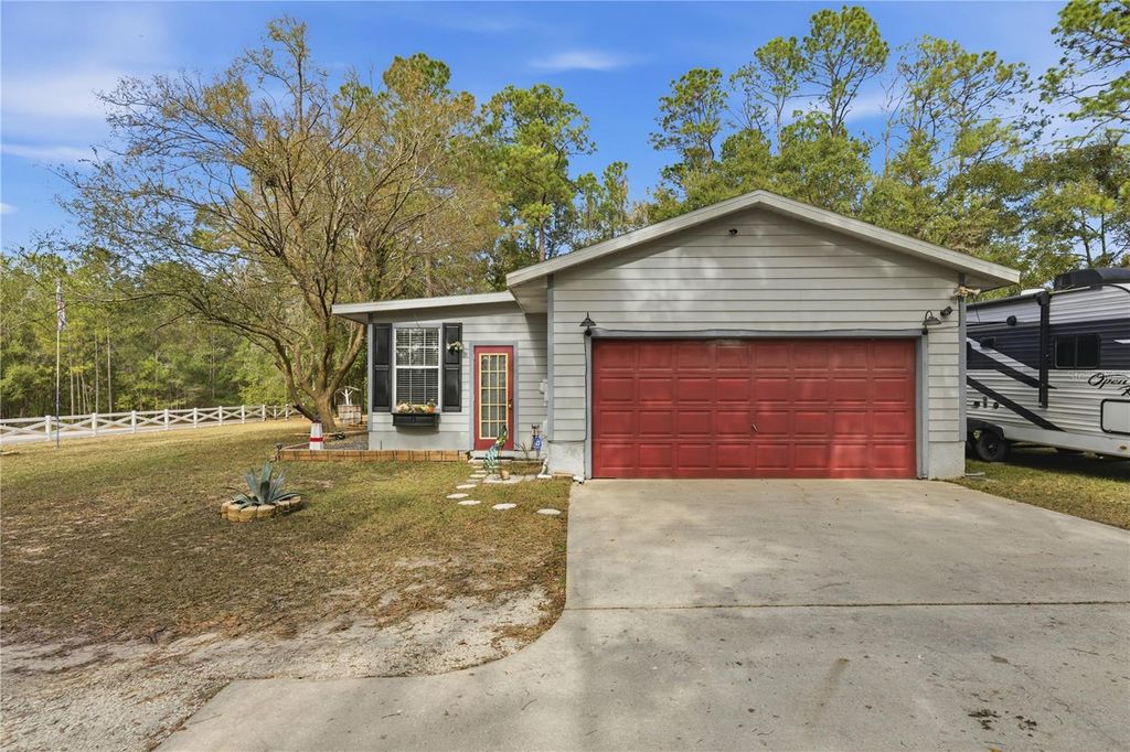 Photo of 7885 SW 202nd Avenue, Dunnellon, FL 34431 (MLS # OM714874)