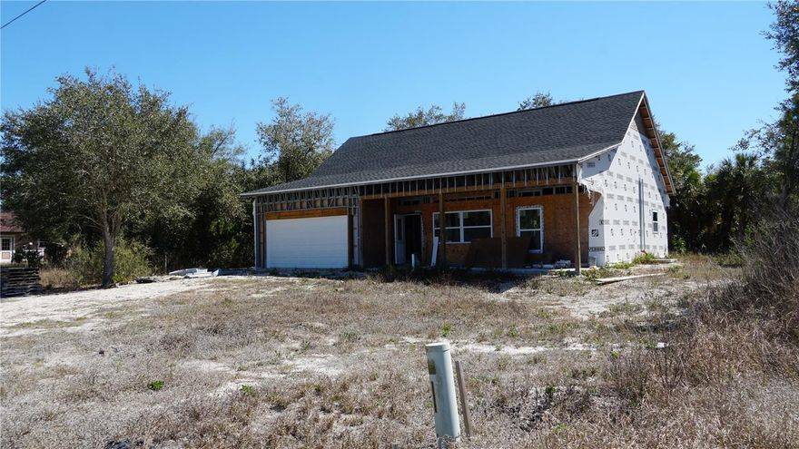 Short Sale. Under Construction. Unique opportunity to complete a partially constructed new home situated on a freshwater canal lot in Port Charlotte. The structure appears to have progressed through several key stages of construction, including installation of the roof, windows, doors, exterior sheathing, and rough plumbing and electrical. The framing appears to utilize metal studs, and the planned layout appears to include two bedrooms, two bathrooms, a loft area, and a two-car garage.

Completing a partially constructed home presents unique challenges and will require careful due diligence by the buyer. Responsibility for confirming permitting status, construction completion, inspections, and final approvals will transfer to the buyer. Buyers are encouraged to consult appropriate licensed professionals and local authorities regarding requirements to complete the project.

Located along a freshwater canal in an established Port Charlotte neighborhood, the property offers the opportunity to finish and customize a distinctive home in a desirable setting.

Size is approximate based on public records.

Agents: Please review all private remarks prior to scheduling a showing.