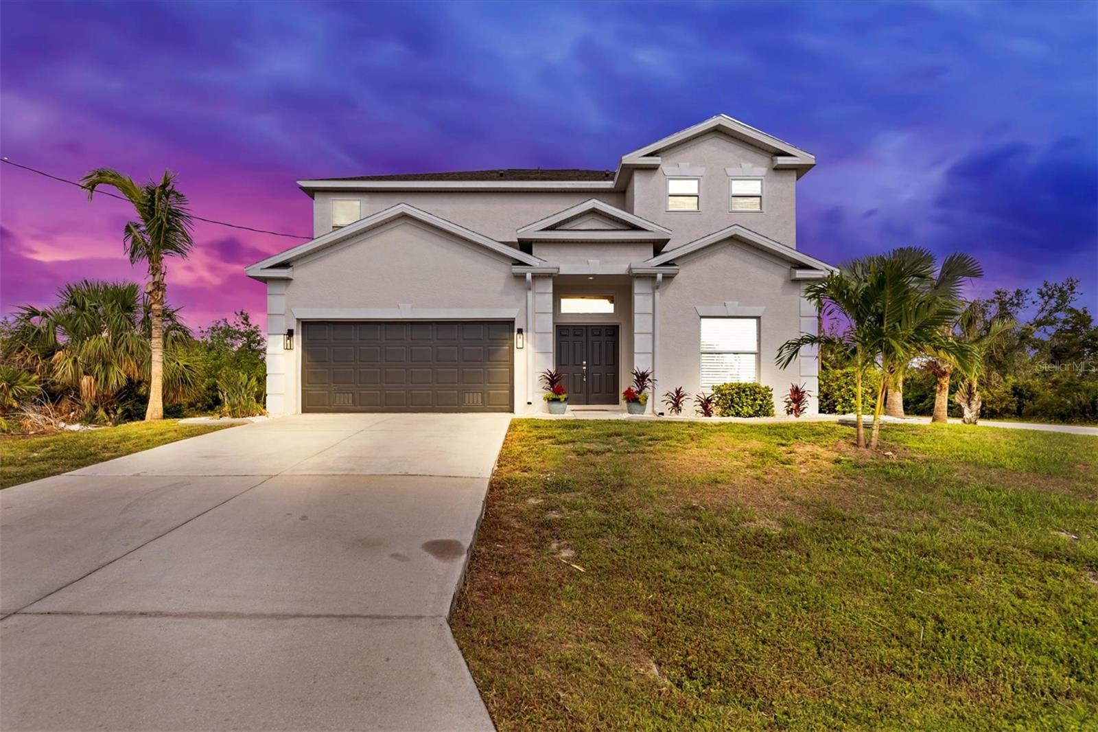This home has it all! Location, space, corner lot, giant zero entry heated saltwater pool with waterfall and fountains, 4 bedrooms on one level with laundry. New roof, new AC, new carpet, all new faucets, paint, granite countertops, lighting etc. Only a few blocks off Placida road for easy commute to shopping, beaches, and schools. Home will have new fence around pool within the next few weeks. This home has two large walk in closets, stainless appliances, pantry, large dining room and a custom fireplace with TV in living room. Three mango trees line the west side of the home and new areca palms plated on the east side for privacy. Easy to show! Professional pictures will be up by Friday.