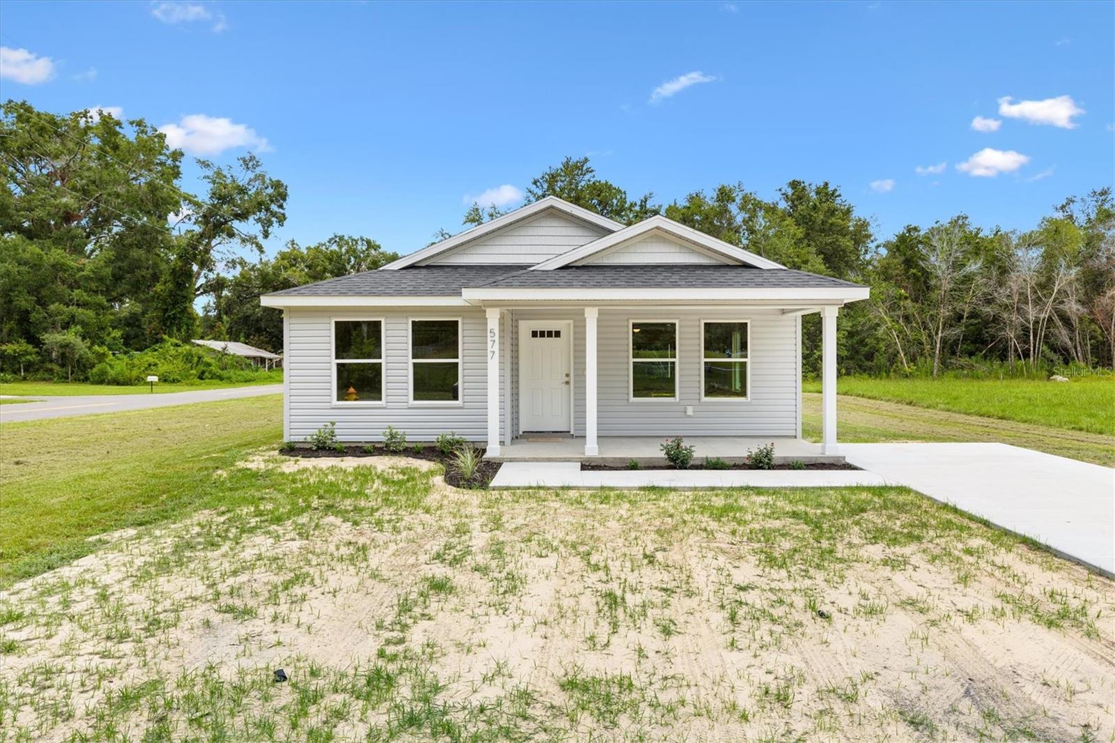 Step into quality and comfort with this brand-new 1451 square foot vinyl siding home designed for modern living. Featuring a spacious open floor plan and split-bedroom layout, every square foot is thoughtfully utilized with no wasted space. From the moment you enter, you’ll notice the Luxury Vinyl Plank flooring flowing seamlessly throughout the entire home—both beautiful and durable.
The kitchen is a showstopper, boasting granite countertops, dovetail cabinetry with soft-close doors, a large center island, and a full suite of stainless steel appliances—perfect for cooking and entertaining alike. Retreat to the primary suite, where you’ll enjoy a double vanity in the master bath and a peaceful, private setting away from the secondary bedrooms.
Enjoy mornings and evenings on your covered front and back porches, ideal for relaxing or hosting guests. Best of all? NO HOA and NO DEED RESTRICTIONS, giving you the freedom to truly make this home your own. Located just minutes from The Villages Charter Schools, Middleton, and a wide variety of shopping and dining options, this home offers both privacy and convenience.
This is the perfect blend of style, function, and flexibility—don’t miss your chance to call it yours!