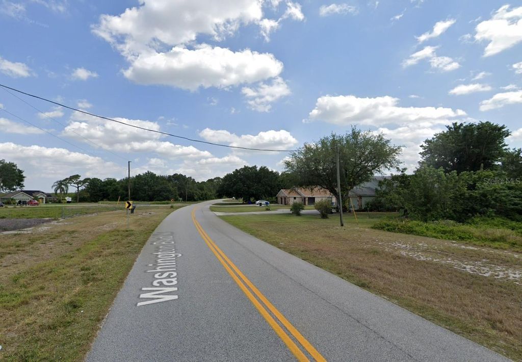 Photo of 803 Washington Boulevard NE, Lake Placid, FL 33852 (MLS # OK225678)