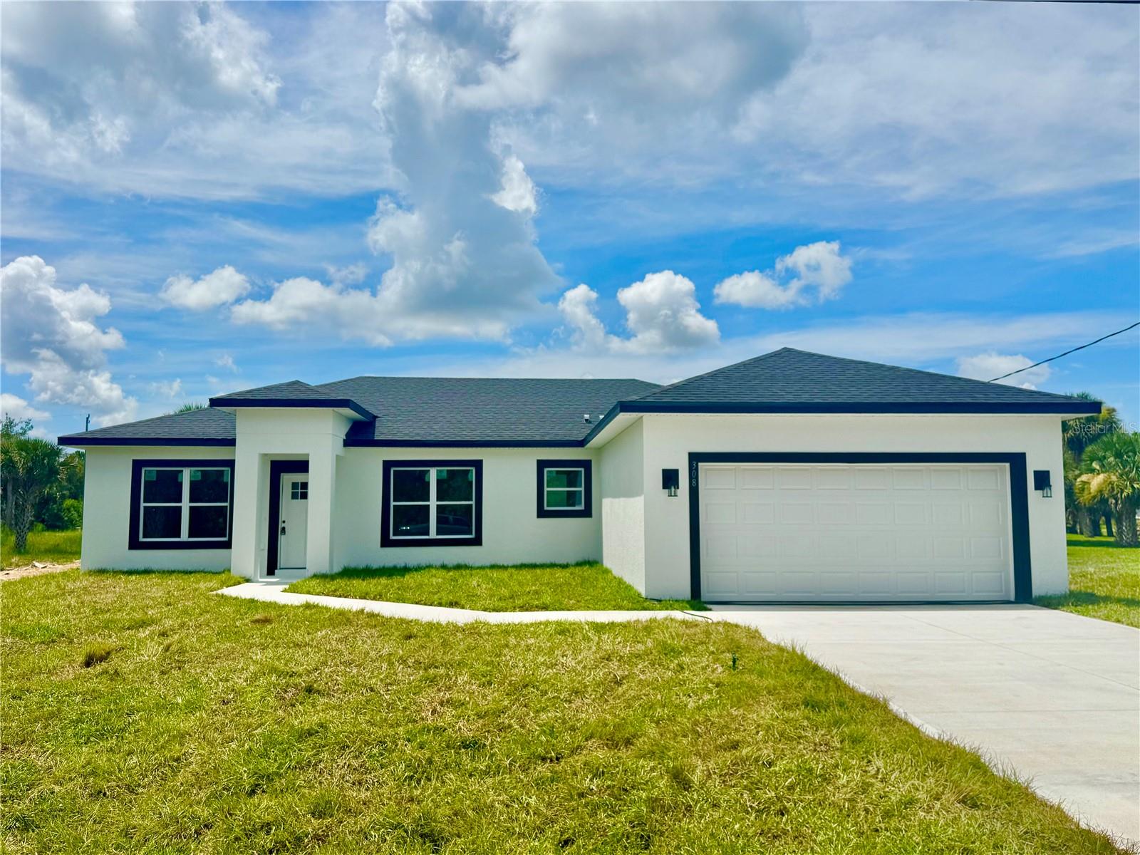 READY TO MOVE! A STUNNING 4 BEDROOM ( 3 BEDROOMS + 1 DEN WITH BUILT-IN CLOSET) AND 3 FULL BATHROOM PROPERTY IN PALM BAY ! Total construction 2,603 square feet, 1894 square feet of heated living space.Primary bedroom with primary bathroom . Bedroom 3 with bathroom. Open, bright and airy floor plan. Kitchen and bathrooms with Sparkling Quartz countertops .Kitchen with waterfall countertop . Complete package of stainless steel appliances and wooden cabinets. High-efficiency air conditioning unit. Showers in bathrooms with ceramic tile up to the ceiling. Laundry room with sink . Large covered porch with sink hook up.