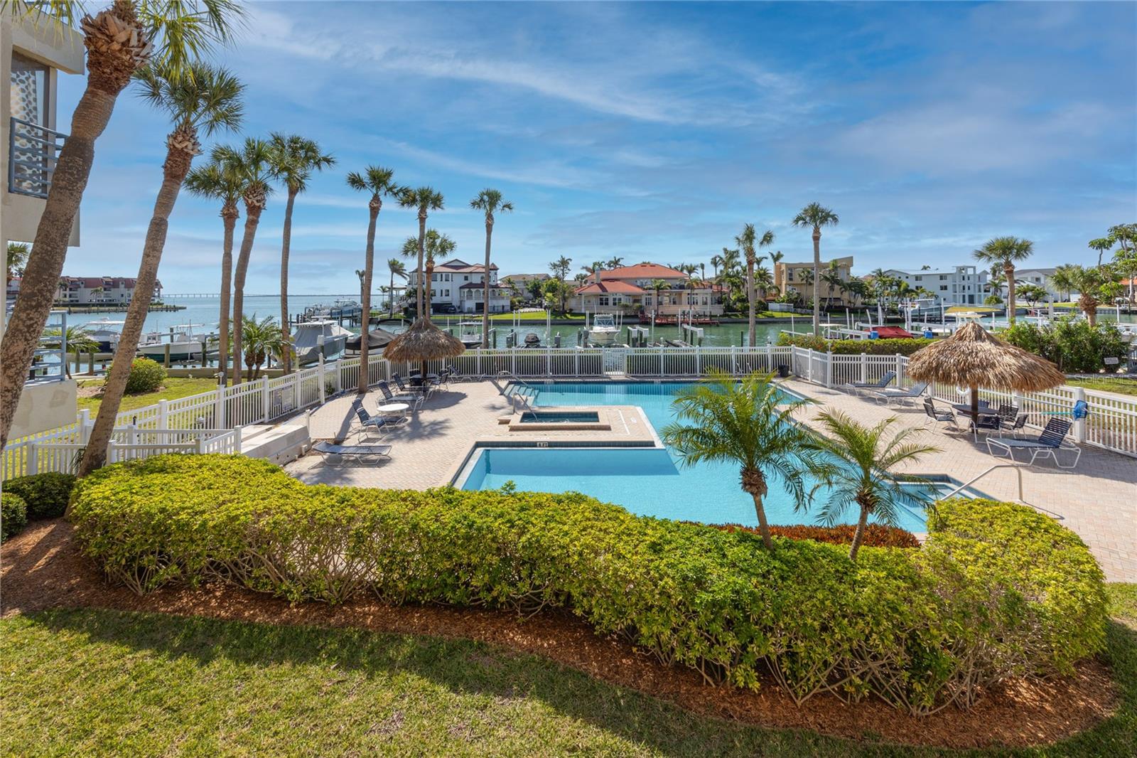 Welcome to your slice of paradise in the heart of Tierra Verde. This 2-bedroom, 1-bath condo in Anchor Cove offers sweeping water views, open-concept living, and a relaxed island lifestyle—just minutes from the beach, local dining, and all the best of the Gulf Coast.
Inside, you’ll find a bright, airy layout with modern tile flooring throughout. The open floorplan connects the kitchen, dining, and living areas, all designed to showcase the gorgeous views of the wide canal and the stunning homes beyond. The kitchen is both stylish and practical, with stainless steel appliances, granite countertops, a breakfast bar, and plenty of storage. A laundry closet with a stackable LG washer and dryer adds everyday convenience.
The oversized living area opens onto a spacious balcony—your front-row seat to peaceful sunrises over the water. Whether you're enjoying a quiet morning coffee or simply soaking in the view, this is the kind of space that makes every day feel like a vacation. You'll also enjoy views of the sparkling waterfront pool and hot tub from your private outdoor retreat.
The primary bedroom is a serene haven with water views to greet you each morning, plus plenty of space for a king-sized bed and more. It connects to a well-designed Jack-and-Jill bathroom featuring dual sinks, a frameless glass shower, and coastal-inspired tilework. The second bedroom offers flexibility for guests, a home office, or whatever suits your needs. For peace of mind, the home is equipped with impact-resistant windows and sliding glass doors, along with electric hurricane shutters—adding an extra layer of protection and convenience.
Additional features include under-building parking, plenty of guest parking, an elevator, and access to refurbished tennis and pickleball courts. Anchor Cove is known for its solid construction, spacious design, and unbeatable location.
You’re just minutes from the sandy shores of St. Pete Beach, historic Pass-a-Grille, and Fort De Soto Park, with quick access to I-275 and two international airports. Downtown St. Petersburg is only a 15-minute drive away.Sorry, no pets. The application fee is $65 per adult, tenant processing fee is $100. HOA approval and a $100 application fee.