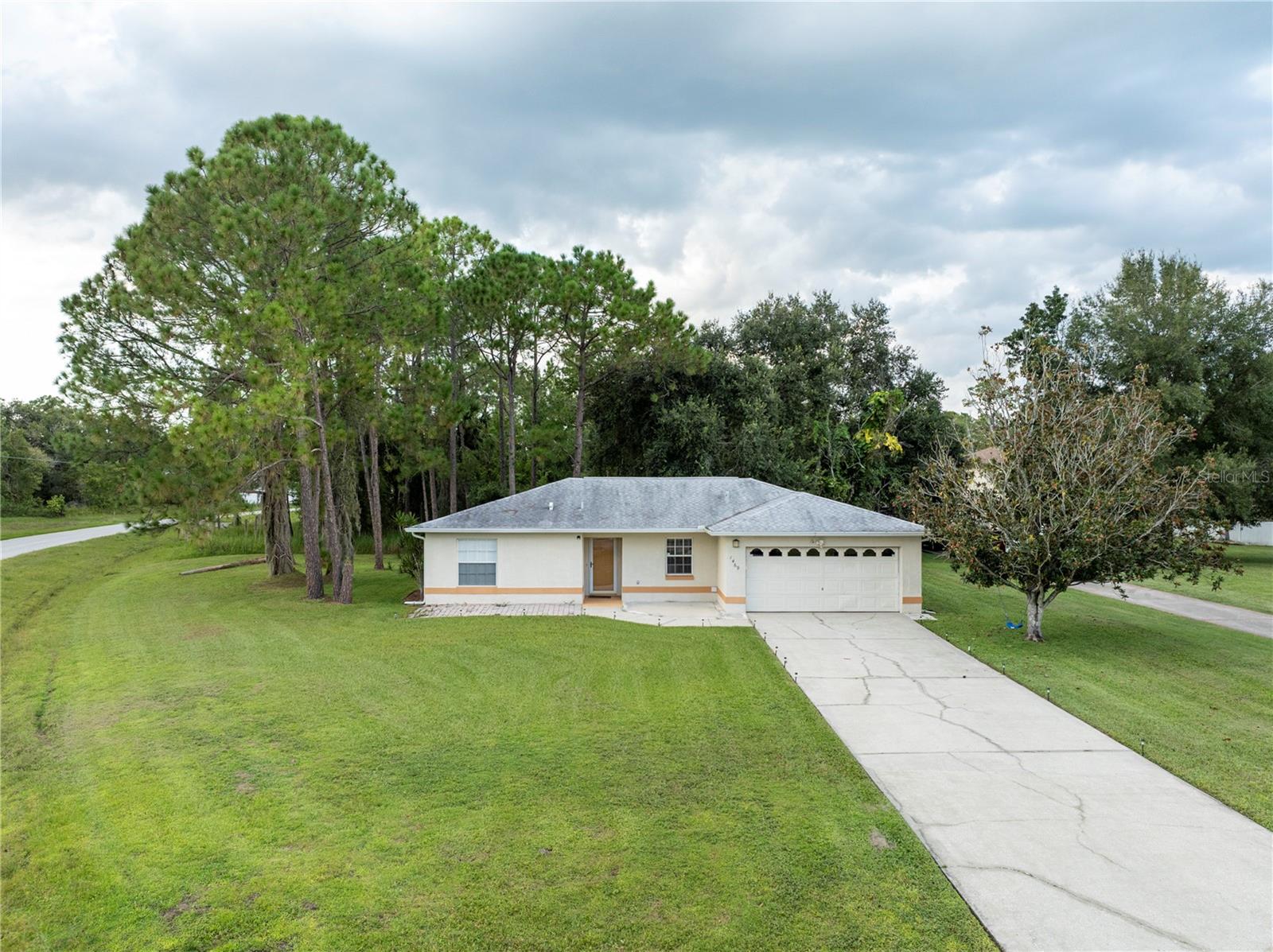 Welcome to 1469 Swan Place, a beautifully maintained 3-bedroom, 2-bath home with 1,718 square feet of thoughtfully designed living space, perfectly situated on an expansive 0.36-acre oversized corner lot at the end of a quiet cul-de-sac. From the moment you arrive, you will notice the wide driveway, mature trees, and peaceful setting that set the tone for the comfort and privacy this home provides. With no rear neighbors, you can relax knowing your backyard is a private retreat surrounded by nature. The enclosed and tiled lanai is the ideal spot to start your mornings with a fresh cup of coffee while listening to the birds and soaking in the calm Florida sunshine, or to unwind in the evenings with a glass of wine and the gentle breeze.
Inside, the home welcomes you with a bright open layout designed for both relaxation and entertaining. Durable vinyl flooring flows throughout, adding warmth and easy maintenance. The spacious kitchen offers plenty of counter space, beautiful granite countertops, and an open view of the living areas so you never miss a moment with family or guests. The primary suite is your private escape with generous space, natural light, and a well-appointed ensuite bath, while the additional bedrooms provide comfort and flexibility for family, guests, or even a home office.
Beyond the home itself, the location is unbeatable. Just minutes away you will find everyday conveniences and shopping such as Publix, Walmart, Ross, and The Loop Mall, along with dining options like Burger King and local favorites. Advent Health Kissimmee Hospital is nearby for peace of mind. Quick access to US-192, Florida’s Turnpike, and SR-417 makes commuting to Orlando or exploring Central Florida’s world-famous attractions simple and stress-free.
The community lifestyle is another highlight. With a low HOA and no CDD, residents enjoy an impressive range of amenities including a clubhouse, fitness center, playgrounds, organized neighborhood activities, and not one but two community pools, including a sparkling Olympic-size pool perfect for staying active or cooling off on warm Florida days. Whether you are hosting backyard barbecues, enjoying community events, or simply relaxing in your private lanai, this home offers the perfect balance of tranquility and connection.
Do not miss this rare opportunity to own a home that truly combines location, lifestyle, and value. Schedule your private tour today and experience everything 1469 Swan Place has to offer!