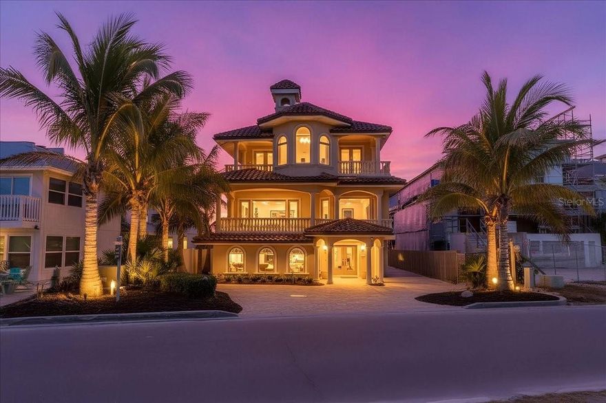 Auction Property. LUXURY REAL ESTATE AUCTION on-site on Friday, February 27, 2026, at 1:00 PM. Previews begin on Saturday, February 7th, and will run every Saturday and Sunday from 1:00 to 4:00 PM until the auction. Private appointments are available; please call for details.
Designed by renowned architect George Merlin and built in 2006 by Christner Brothers to hurricane-resistant building code, this home rests securely on concrete-driven pilings and exudes unparalleled quality. Watch the sunrise over the Intracoastal Waterway from the deepwater boat dock and lift. Spend the afternoons on your private beach along the sandy shore of the gulf where spectacular sunsets are almost guaranteed. Inside nearly 8,000 square feet, five bedrooms with en suites, nine baths, formal living, family and sitting rooms, dual private offices, den and a theater room provide seemingly endless enjoyment. Crown molding, trayed ceilings, travertine flooring, three fireplaces and Yoder Brothers custom cabinetry exude elegant touches throughout. An elevated lagoon-style swimming pool is great for a cool dip or relax in the heated spa and outdoor fireplace on a chilly evening. The gourmet kitchen is large enough to host an impressive dinner party and gather with family and friends. Casey Key is a place like no other, where residential homes line the shores, absent of commercial building and high-rise condominiums. Development is restricted to single-family homes, yet all conveniences of shopping and restaurants are minutes away. Private and commercial air travel are easily accessible. Sports and cultural entertainment enthusiasts will find golf, tennis, theaters, music and more, just a few miles away in nearby Venice and Sarasota. There’s something for everyone in this gulf to bay resort-style home.