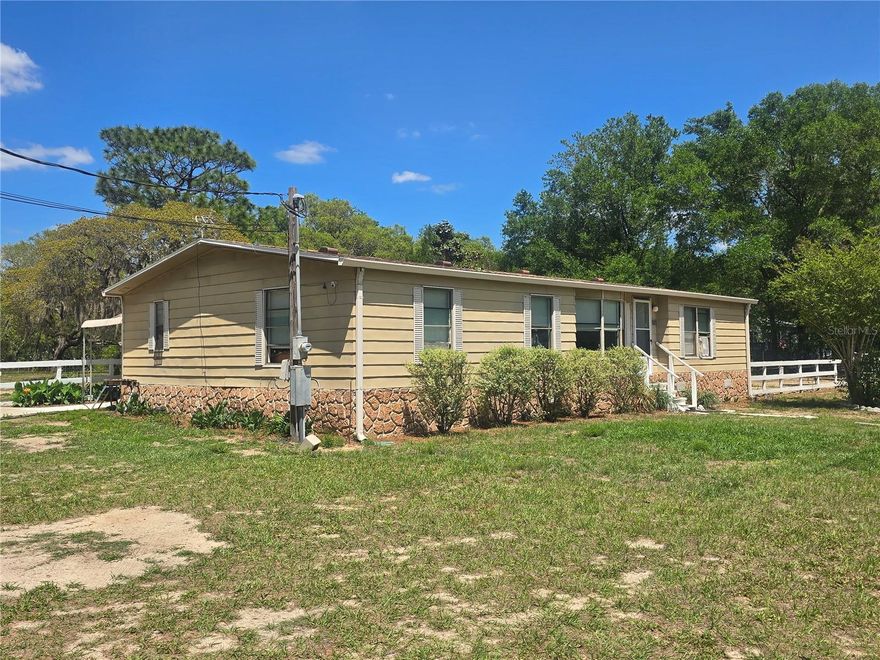 An opportunity you don’t want to miss to build real equity on the Nature Coast. Sitting on 1.25 acres, this 3 bedroom, 2 bathroom home is ready for its next owner to step in and create value. The lot is cleared and usable with a fenced backyard for kids and pets, plus a detached two car garage for all your tools, toys, and projects. Inside offers a solid starting point with tile flooring, newer cabinetry, a wood burning fireplace, bay windows bringing in great natural light, and a split floor plan with the space buyers are looking for. Located in Hernando near the Withlacoochee State Trail and the Tsala Apopka Chain of Lakes, you get quick access to biking, fishing, and the outdoor lifestyle that makes this area so desirable. Whether you’re looking for a home to make your own or an investment with upside, this one checks the boxes.