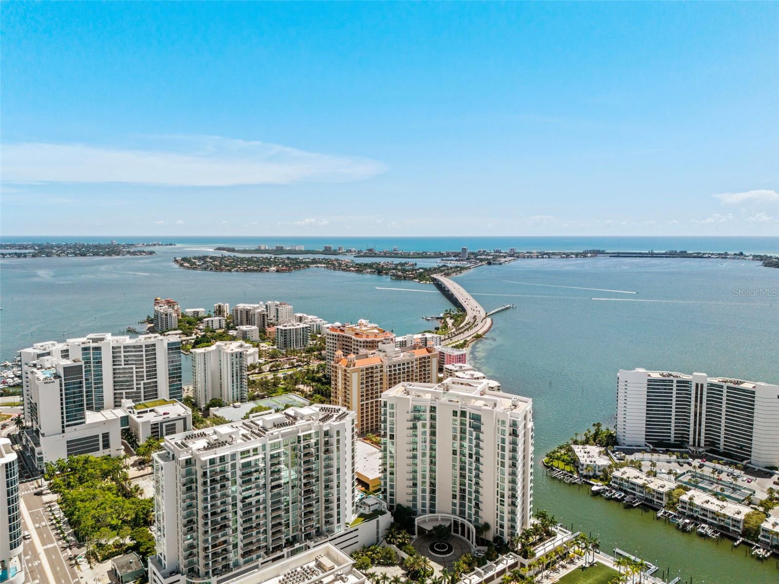 LUXURY LIVING AT BAYSO ON THE HIGHLY SOUGHT AFTER SOUTH SIDE OF THE BUILDING! THE SIDE WITH NATURAL SUNLIGHT AND A WATER VIEW THAT MAKES ALL THE DIFFERENCE FOR THOSE SEEKING A FLORIDA LIFESTYLE! | View Property Video at this link - https://motion-media-llc.aryeo.com/videos/01964719-0566-7245-9392-8247a98cdb55 | Experience a rare and exceptional opportunity in the heart of downtown Sarasota. This luxurious condo at BAYSO boasts 12-foot ceilings, floor-to-ceiling windows, European Cabinetry by Italkraft, JennAir Appliances, an induction cooktop, quartz countertops and an abundance of natural light, creating a bright and airy ambiance. Additionally, the final touch has been completed in the kitchen with the installation of a timeless marble mosaic backsplash. However, what truly sets this residence apart is the private 700+ square foot terrace—a feature that is nearly impossible to find in high-rise living and redefines luxury condo ownership. A TERRACE LIKE NO OTHER | In Sarasota’s luxury market, outdoor spaces of this size are an extraordinary find. This expansive private terrace offers unparalleled versatility, making it an extension of your home. SUNBATHING & RELAXATION - Enjoy the Florida sunshine in complete privacy, with ample space for lounge chairs, an outdoor daybed, or even a hammock. ENTERTAINING - Host unforgettable dinner parties, relaxed brunches, or evening cocktails with the city skyline and Sarasota Bay as your breathtaking backdrop. BREATHTAKING VIEWS - Watch boats glide across Sarasota Bay by day, then take in the twinkling cityscape at night for an ever-changing view. PERFECT FOR PET OWNERS – Unlike most condos, this home offers private outdoor space for your furry companion. Plus, the on-site dog park is just steps away for added convenience. VERSATILE OUTDOOR LIVING – Whether setting up a yoga space, an outdoor office, or an area for games, this terrace provides unmatched flexibility. SOPHISTIATED INTERIORS & UNMATCHED CONVENIENCE | Step inside, and you’ll be captivated by the open, airy design. The 12-foot ceilings enhance the openness, while floor-to-ceiling windows flood the interior with natural light. The seamless flow between indoor and outdoor spaces ensures a home that is as functional as it is elegant. This residence is also perfectly positioned within the building, with direct access to BAYSO’s resort-style pool, splash lounge, and dog park—all on the same level, making luxury amenities effortlessly accessible. And it gets better, enjoy two assigned parking spaces that are conveniently located to the elevator for ease of getting items from your vehicle to your residence. THE BEST OF SARASOTA AT YOUR DOORSTEP | Located in The Quay Sarasota, BAYSO offers walkable access to the city’s finest attractions. Indulge in gourmet dining, boutique shopping, and waterfront strolls, all just minutes from your doorstep. Enjoy live performances at the Van Wezel Performing Arts Hall, visit the nearby marina, or take a short drive to experience Sarasota’s world-famous beaches. A RARE OPPORTUNITY IN DOWNTOWN SARASOTA | With its expansive terrace, luxurious interiors, and prime location, this condo offers an unparalleled lifestyle in one of Sarasota’s most sought-after buildings. This is a rare opportunity to own a one-of-a-kind residence that blends the best of urban living with the serenity of a private outdoor retreat. DON’T MISS YOUR CHANCE – CONTACT ME TODAY FOR A PRIVATE SHOWING!