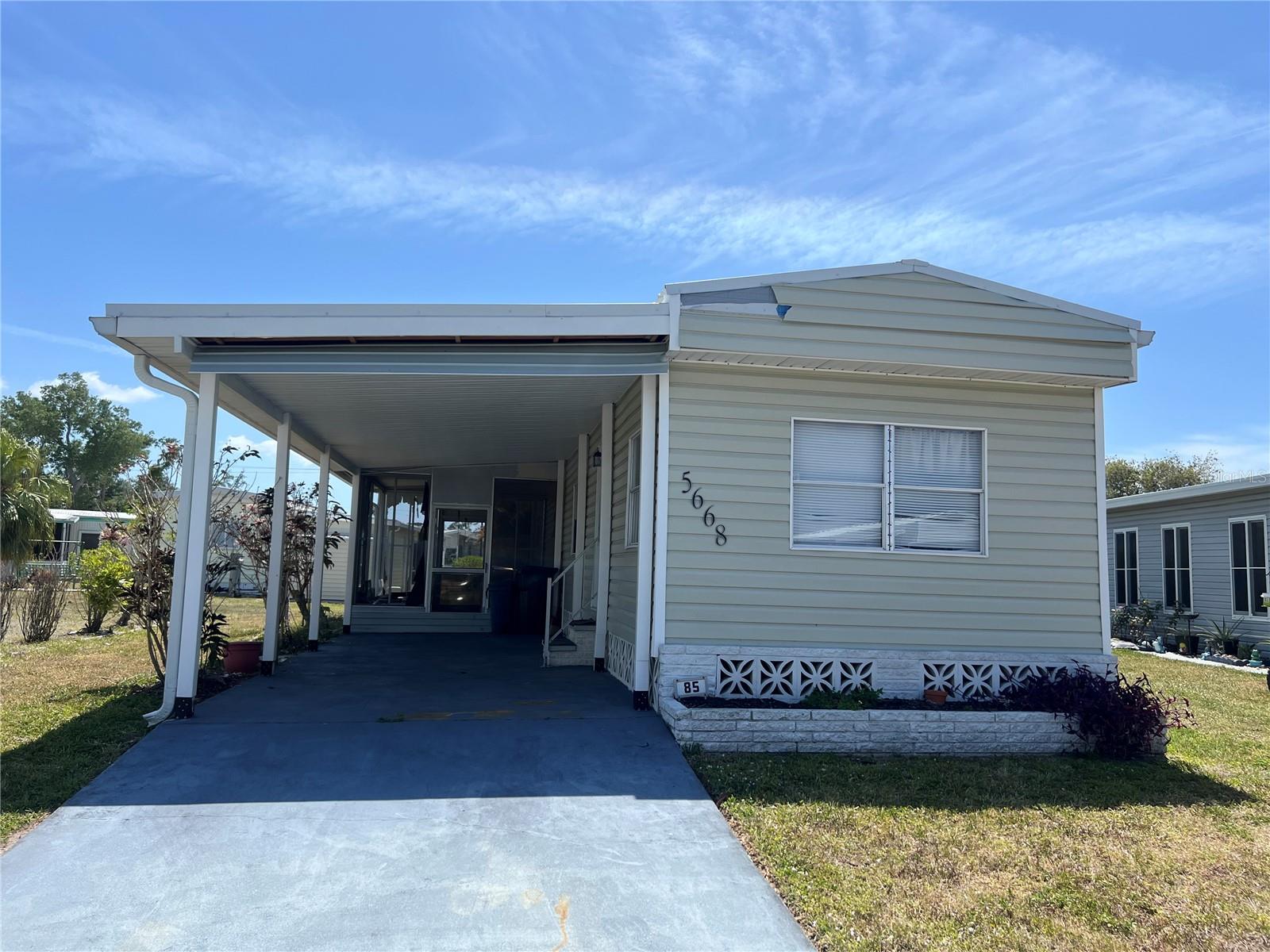Welcome home to your Florida Retreat! Holiday Park is a desirable 55+ mobile home park that you own your land with a deed! This single wide is ready for a new owner. Mobile home is ready to move into. Mobile home is being sold As/Is. New roof installed in 2022, new carport in 2022, New A/C installed in 2023. Holiday Park has lots to do too. Enjoy the 2 heated community pool, 3 tennis courts, 4 pickleball courts, 3 bocce ball courts, 14 shuffleboard courts, 6 horseshow pits, library, fitness center, billiards, clubhouse and if needed boat and RV parking. Lots of social activities to enjoy. Shopping, big box stores and restaurants all nearby too. The park is gated for added security. Wellen Park is only 5 minutes up the road. Wellen Park features lots of family friendly activities like outdoor concerts, fishing, restaurants, shopping and a weekly farmers market for your fresh foods. The Atlanta Braves Spring Training camp is in Wellen Park too. The famous Warm Mineral Springs is only minutes away too. Venice Beaches and famous historic Venice downtown is only 20 minutes away! You will love where you live in North Port, Florida. Call for a private showing.