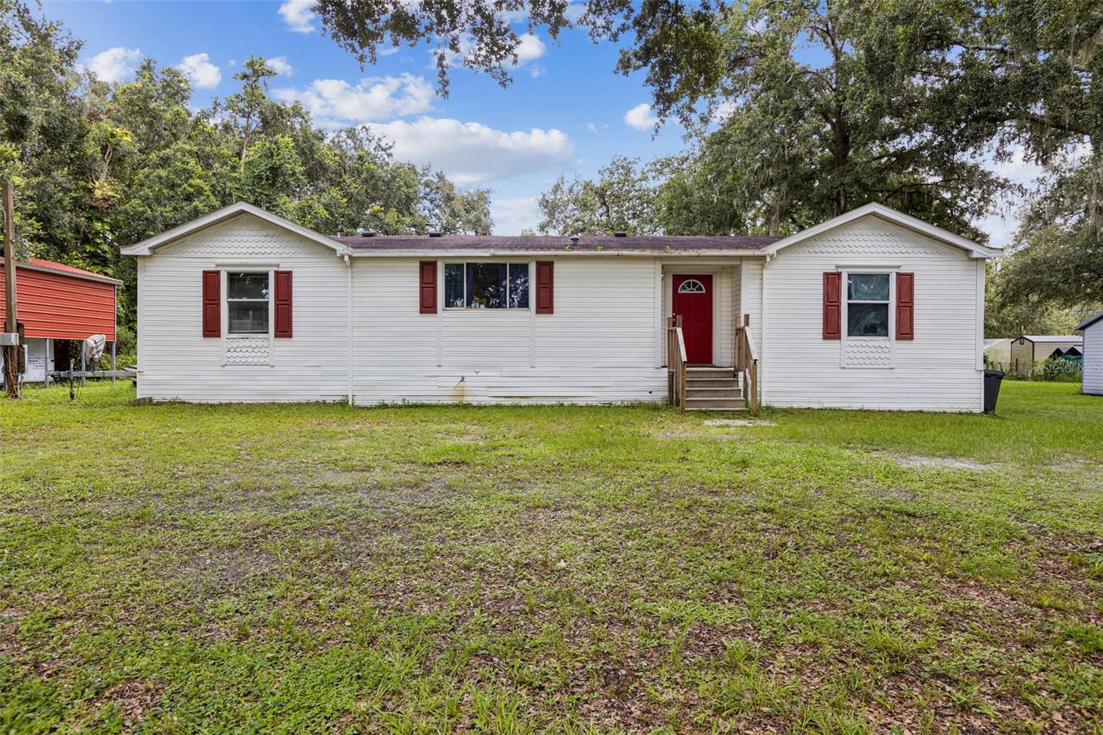 This is a hidden gem with tremendous potential nestled in one of Plant City's most desirable areas! This 3-bedroom, 2-bathroom manufactured home sits on a generous 1.58 acre lot and offers a solid structure ready for your personal touch or renovation vision.
Yes, it needs some TLC, including a new AC unit, but opportunities like this don't come often. Whether you're looking to renovate and live, flip, or add to your rental portfolio, this property offers the perfect foundation. Surrounded by well-maintained homes and peaceful rural charm, yet still close to major highways, shopping, and schools, this location offers the perfect blend of quiet living and convenience. Get your showing today!