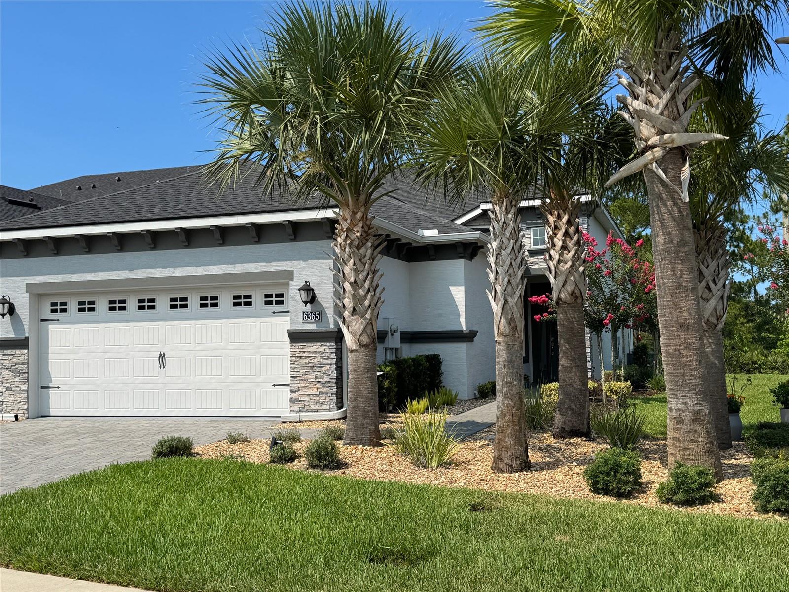 Just available – a charming Port Orange villa in an upscale, gated community. This
maintenance-free, 1,562 SF, outside unit has two bedrooms and two baths, a flex/den area and a
two-car garage. The exterior includes upgraded accents and a paver drive and walkway. HOA
covers exterior painting, roofs, landscaping and termite bond. The interior has numerous
upgrades including: a beamed, great room ceiling, crown molding throughout, a stone accent
wall, upgraded fans and lighting, plantation shutters, power shade over 3-section sliders and has
been beautifully painted. The envision level, tile floor and grout have been professionally sealed
and comes with a lifetime guarantee. The spacious kitchen includes multiple upgraded 42”
cabinets with extensive storage, granite countertops, subway tile, upgraded faucet and under-
cabinet lighting. The owner’s suite includes a wood-trimmed accent wall, LVP flooring with a
pocket door leading to the walk-in closet and bath. This area also includes a closet barn-door,
frameless shower enclosure and pebble shower floor. Both baths include new higher level toilets
and quartz countertops with coordinated cabinets. The lanai has been closed in with wood-
trimmed walls and functional windows to make a perfect sun-room area overlooking a wooded
easement. The flex/den includes a quartz-top desk, stone accent wall and shelving, while the
second bedroom offers plenty of flexible space with a built-in Murphy Bed. The villa comes with
upgraded GE appliances, an alarm system and a 15 SEER HVAC system with UV lighting.
Additional features include 10’ ceilings with 8’ doors, R-30 insulation and high-performance
LoE windows. The community also has an amenity center with a beautiful, large pool, open and
covered picnic tables, play area and restrooms. Located off Williamson Blvd. in a quiet
subdivision, Woodhaven is just a five-minute drive to Taylor Rd. with grocery and drug stores,
restaurants, the Port Orange Pavilion, two hospital emergency facilities and access to I-95. This
meticulously maintained property, ideal for retirees or snowbirds, is move-in ready with
negotiable furnishings.