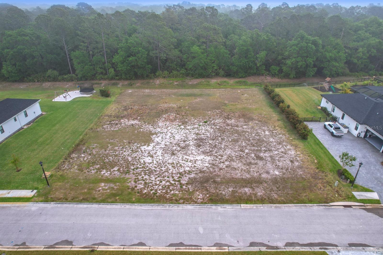 Rare opportunity! This spacious lot, just over half an acre, offers the ideal foundation to build your dream home.
Notably, the property remained flood-free through the last two hurricanes, providing added peace of mind. Enjoy
the convenience of nearby shopping, and quick access to I-4. Don't miss out on this perfect blend of tranquility
and accessibility!