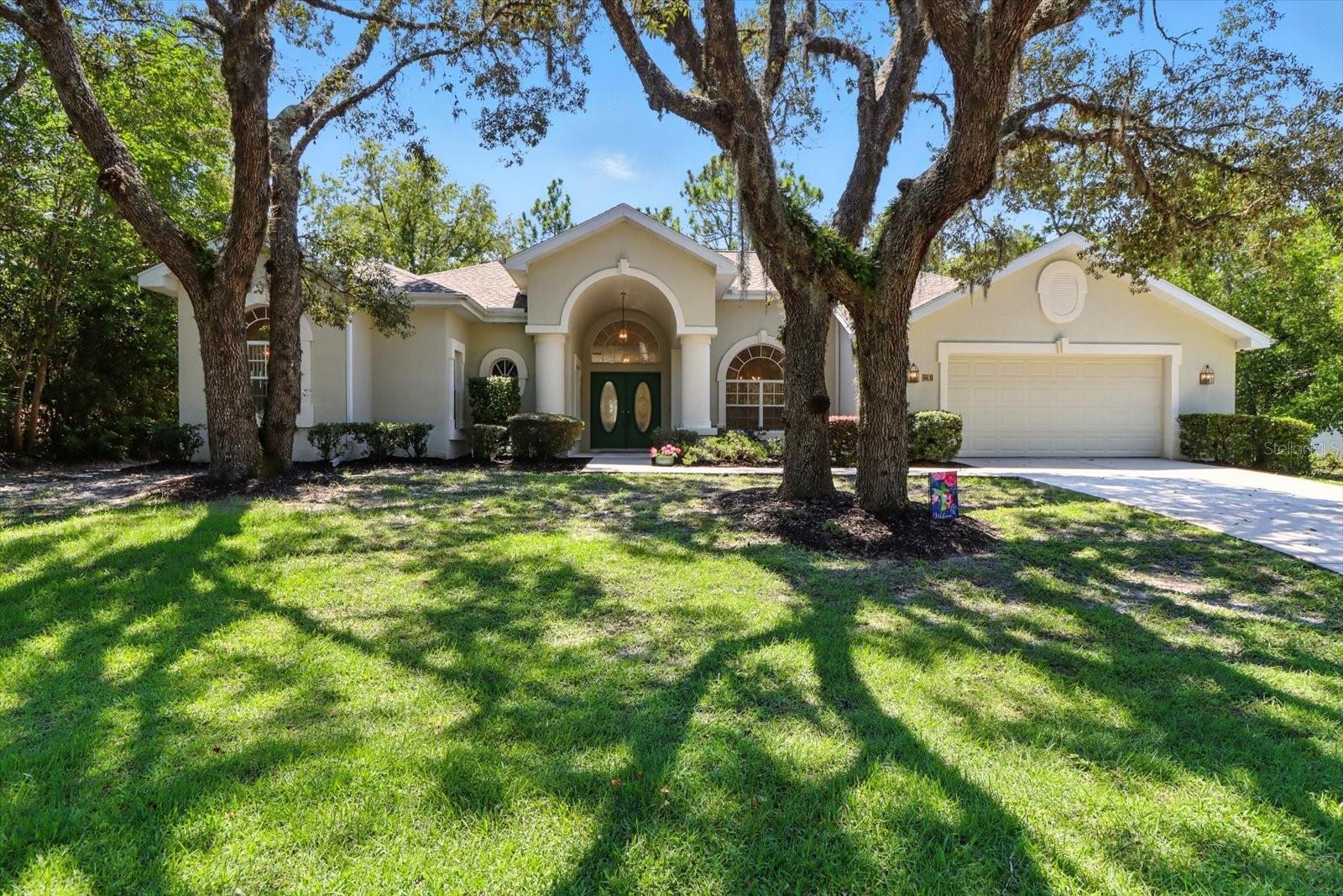 Immaculate custom-built pool home in Sugarmill Woods—move-in ready! This beautifully maintained one-owner residence offers over 3,080 square feet of living space with three spacious bedrooms, two and a half baths, and a bonus office or den. Built of solid concrete block and cared for with no pets and no shoes indoors, the home feels truly pristine.
The setting is as peaceful as it is unique, with a deep greenbelt behind and a wooded drainage area in front, creating rare seclusion and serene views. Recent upgrades include a brand-new roof and a new 5-ton HVAC system, both completed in 2023, offering comfort and efficiency for years to come.
Inside, a gracious layout combines formal living and dining rooms with a large open-concept kitchen that overlooks the family room with a gas fireplace and cozy breakfast nook. All of these spaces flow seamlessly to the screened lanai and sparkling pool. The split floor plan enhances the primary suite, while a dedicated pool bath with exterior access makes entertaining easy.
Additional highlights include a security system, in-wall pest control, outdoor pool shower, and an oversized two-car garage. Optional membership at the Sugarmill Woods Country Club expands your lifestyle with golf, tennis, pickleball, a fitness center, community pool, and dining.
Perfectly positioned just minutes from the growing shopping and dining hub at US-19 and Highway 98, and only an hour from Tampa International Airport, the home is also surrounded by world-class fishing, natural springs, and top-rated schools. This combination of location, quality, and care makes it a rare find in today’s market.
Schedule your tour today and discover why so many love calling Sugarmill Woods home.