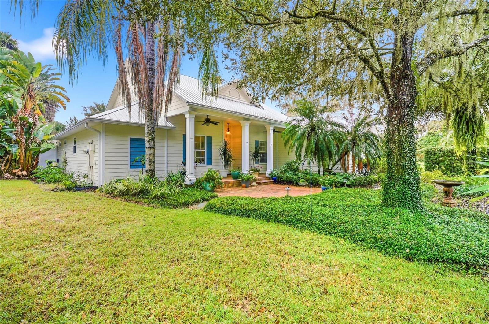 Experience one of the most unique properties you'll ever see. Located on a barrier island in the Hammock of Palm Coast Florida, just a mile from the beach and steps away from the Intracoastal, this stunning estate is surrounded by mature old oaks and lush landscaping, creating a peaceful natural sanctuary. The home features 4 bedrooms, 2.5 bathrooms, an office, a family den, and is situated on a double lot with a separate 48x18x17 RV or boat garage fully equipped with water and electric.
Walking up to the front door you are welcomed by a hidden garden behind a natural green hedge, here you can relax on your secluded front porch; a bird lovers dream. The backyard feels like your own private resort. It can compete with any tropical island paradise, it features an infinity pool, spa, sun-shelf and a Seminole Indian-built tiki hut and outdoor firepit making it perfect for outdoor living and entertaining.
The Hammock is unincorporated to Palm Coast and there are no restrictions with any recreational vehicles. You can have Boats, RV's, and as many vehicles as you want. There are no rental restrictions, short term rentals are allowed.
Located 30 minutes from downtown Saint Augustine and 15 minutes from Downtown Flagler Beach. The Hammock is home to Malacompra bike trails, many walking paths, Bings landing which is a river front park with boat launch.
This property is a rare find—secluded, elegant, and perfect for those seeking a serene paradise.