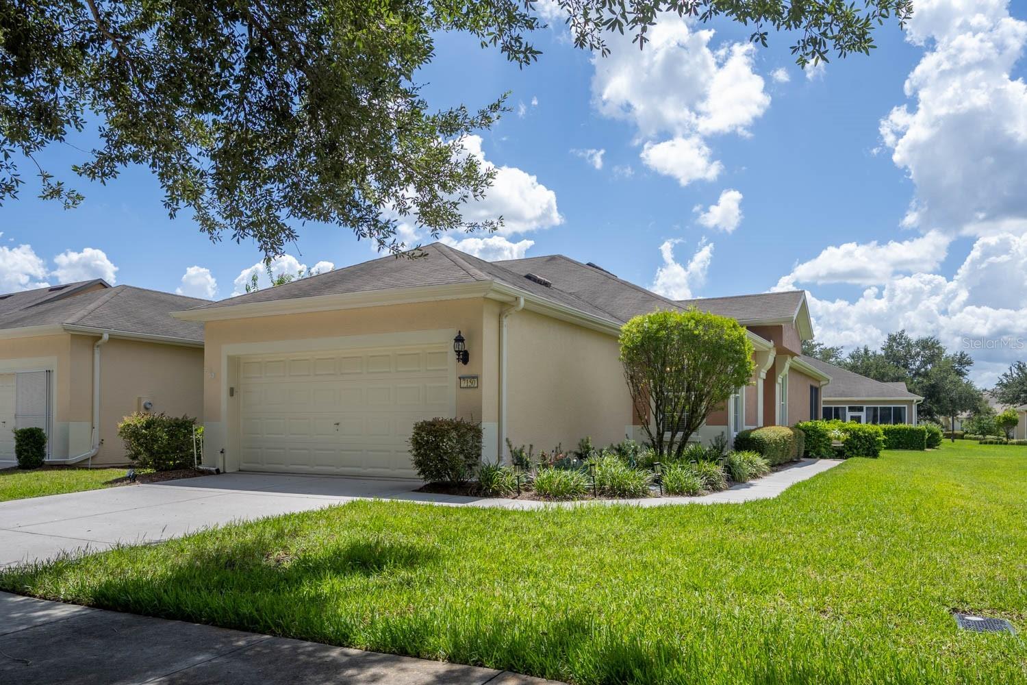 PRICED TO SELL includes a Golf Cart!! This immaculately maintained Augustus villa is ready for immediate occupancy. Two bedroom, two bath, split floor plan with a flex room. Very large open floor plan with kitchen/dining and living area. Great for Entertaining. Kitchen has solid wood cabinets, SS appliances with new refrigerator and Corian countertops. Large laundry room with cabinets. You will enjoy the screened in lanai, perfect for reading. Ceramic tile throughout except engineered hardwood in the bedrooms, NO CARPET. No need to worry about the exterior maintenance. It’s all included in the HOA fee. Roof repair as well as replacement, exterior power washing and painting, landscaping, including mowing, trimming and shrub trimming, irrigation water and sprinkler repairs, plus exterior insurance policy. This leaves you more time to discover the extraordinary active-adult life style at Del Webb Stone Creek. With amenities like an 18-hole golf course, restaurant, pools, sports courts, Gym, two clubhouses. And many, many clubs for your enjoyment. Your retirement days will be stress free, filled with activities to make new friends and memories.
