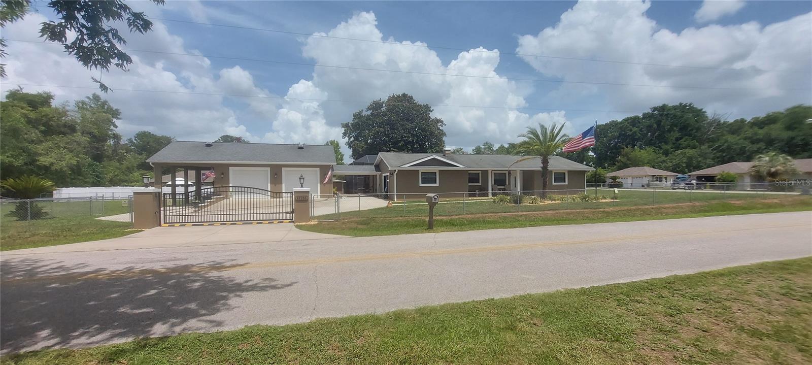 Your Summerfield, Florida home and oasis awaits you! The perfect move-in ready home, no paint brushes needed simply pack up and drive through the double side gate and pull in your boat, trailer, or any extra toys you may have! The driveway is attached to the home, through a convenient covered walkway, you will find an oversized two car garage with a 2-ton AC and a pull down ladder for additional storage, a full bath that is wheelchair accessible, a speaker system that is in the garage for your summer long entertainment, as well as in the RV port as added convenience. Home has nice 3 bedrooms, 3 bathrooms, Saltwater pool (heated) with over 30,000 gallons of heated water to basked in, fully automated features. The 30’x67’ pool cage gives you lots of peace and privacy for entertainment including outdoor kitchen and with an outdoor fire pit nearby. Full weight room for keeping in shape all year long in the privacy of your own home gym. New Well pump, recently painted exterior with great curb appeal – Security Cameras and Security Lights included. Several furnishing items will remain, call for more detail. Home is within minutes to the new WEC, The Villages, Ocala Local Shopping, & Local Restaurants! Call NOW and schedule your showing! Buyer and Agent to verify all data as part of their due diligence!