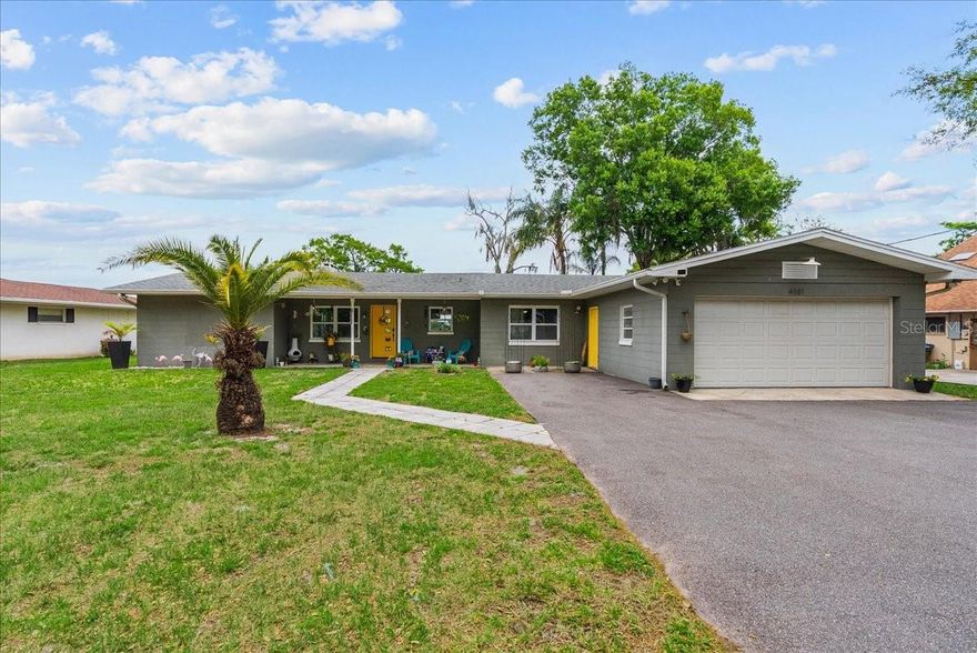 Rare dockable waterfront opportunity on Lake Cecile with no HOA, just minutes from Disney. This renovated 3-bedroom, 2-bath ranch sits on a private ¾-acre lot with 75 feet of lakefront in a secluded community offering peaceful waterfront living with exceptional proximity to shopping, dining, schools, and Orlando’s resort corridor.

Recent improvements include new driveway, newer double-paned windows, tankless water heater, plus a beautifully updated kitchen with solid surface countertops, farmhouse sink, stainless steel appliances, subway tile, and custom island. Interior features include exposed brick accents, statement ceilings, electric fireplace, wood-look luxury vinyl flooring, and designer finishes throughout.

The primary bedroom features French doors with Lake Cecile views, while a bonus flex room currently serves as a home gym and could function as office or studio space. Long private driveway, enclosed garage, mature trees, and classic ranch curb appeal add to the property’s charm.

Dockable frontage on Lake Cecile offers future boating and fishing potential. Unique opportunity with no HOA,  potential investment opportunity, modern upgrades, and true lakefront living near Disney.

Washer, Dryer and Blue Barn door in Living room do not convey.