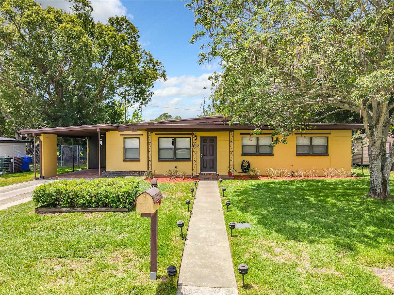 Under contract-accepting backup offers. Completely renovated, this solidly-built home in the quiet, well-established and centrally-located Dellwood Park neighborhood is ready to welcome its new owner. This 3-bedroom, 1 bathroom home has floor-to-ceiling retrofitting -- including new flooring, completely new electrical and plumbing systems, new air-conditioning/heating system (all with warranties). The entire kitchen (including brand new appliances) and bathroom have been fully upgraded -- not to mention new doors, blinds and fixtures throughout the house. Along with its extra-large storage shed, brick-paved carport and expansive covered and screened patio, the home is fitted with removable hurricane shutters. A complete irrigation system maintains the well-landscaped yard. Another plus is there are no Homeowners Association fees. This house is move-in ready like a brand new home.