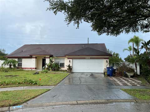 Photo of 1302 Norwick Drive, Lutz, FL 33559 (MLS # TB8531910)