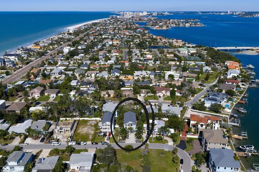 If you missed out!  BACK on MARKET!!!  Come enjoy the sunsets views from the front porch and only steps away from the beach.. This beautifully maintained estate is ideally positioned on the same street as the pedestrian cross walk which adds convenience & safety! 
Set within one of the area’s most private and residential coastal communities, this custom elevated home offers enduring quality, thoughtful design, and a lifestyle that blends sophistication with beachside living. The whole house generator (Generac) also gives a comfort security that you will always have power.  Beyond the welcoming entry, an elevator connects to all levels, opening to a light-filled great room featuring 2-story ceilings, floor-to-ceiling windows dressed in plantation shutters, and a dramatic stone fireplace with custom built-ins. The gourmet kitchen combines style and function with granite counters, wood cabinetry, stainless steel appliances, and a spacious walk-in pantry. A stylish wet bar with glass-front cabinetry and a wine fridge leads seamlessly into the dining room—ideal for effortless entertaining.  
The main-level primary suite is a serene retreat with a luxurious ensuite offering a heated tub, separate shower, double sink vanity, and a custom walk-in closet. Upstairs, a loft with a glass-block half wall overlooks the great room and a secondary primary suite on this level which provides its own spa-inspired bathroom, double vanity, glass-front shower, makeup desk and generous closet space. The upstairs also has the third bedroom and a large bonus room/home theater/office/gym or game room complete with kitchenette and granite countertops.  
The lower garage level is designed for convenience, storage, and coastal living: a 2-car garage (3-car tandem) and a dedicated golf cart entry, workshop area, and a screened-in porch perfect for relaxing with the oversized TV after a day at the beach. Four balconies, professional landscape lighting, and multiple outdoor spaces create a seamless flow between indoor comfort and outdoor enjoyment.
This residence is further enhanced with a whole-house generator, newer tankless gas water heater, water softener, brand-new roof (2025), serviced HVAC still under warranty, and all TVs conveying. The elevator and Generac generator were both recently serviced, ensuring peace of mind for years to come.
With beach access directly across Gulf Blvd, daily sunset strolls, morning walks, and the laid-back charm of Belleair Beach become part of your everyday rhythm. This mint-condition home offers the perfect combination of craftsmanship, comfort, and coastal luxury—ready to welcome its new owner.  The remaining mortgage balance is ASSUMABLE at 2.49% with approval from Chase Mortgage.