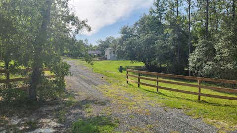 Photo of 2251 SE 146th Circle, Morriston, FL 32668 (MLS # OM727603)