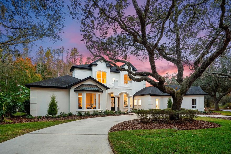 A Masterful achievement of concept and design, this stunning traditional custom built 2-story home is located on a 33,907 sqft cul-de-sac lot in one of Tarpon Springs coveted manned gated community - Wentworth showcases exquisite craftsmanship, classic elegance & cutting-edge design. Seamlessly integrated indoor/outdoor spaces with floor to ceiling glass French doors & luminous open spaces. Leaded bevel glass French doors open into the symmetrical combination formal living and dining room: Chevron pattern luxury vinyl floors, coffered ceiling, sleek sophisticated marble gas burning fireplace congruent with an arched mirror & 2 artist niches capture the ornate dining room chandelier, glass French doors open onto the screen enclosed lanai, covered patio with shiplap & ceiling fan - salt water pool/gas heated spa - extensive paver patio & outdoor stainless grill. Privacy prevails - no rear or side neighbors! The contemporary clean look of this culinary kitchen features: cocoa solid wood cabinet panel doors, extensive quartz countertops, black appliances, crown molding, walk-in pantry, under cabinet lighting, 6 burner natural gas cooktop & 2-ovens + 2 additional ovens, low bar center island perfect for afternoon snacks. Dinette opens to the pool patio. Great room features: horizontal shiplap, flat screen TV, natural gas fireplace, symmetrical picture windows, shiplap tray ceiling - chandelier, triple glass slider to pool. Coffee/wine bar, quartz top, sink, cabinet storage. French doors - First floor master suite coffered ceiling, separate sitting area opens to the pool, adjacent nursery or den. Sumptuous master bathroom his/her 2-sink quartz top vanities, make-up vanity, porcelain tile floors, free standing soaking tub, designer lights, subway tile walk-in shower, separate water closet, linen storage. French doors open into the 1st floor bonus room perfect for a playroom, game room, billiards room or 6th bedroom. Home office features built-in shelving & cabinets, crown molding, plantation shutters. Powder room. 1st floor guest bedroom with adjacent full bath, vanity & walk-in shower. 2nd floor bonus room is perfect for any family. Additional 3 bedrooms: 1-bath en-suite, the other two guest bedrooms share a 2-sink vanity tub/shower bathroom. Interior laundry, utility sink, washer & dryer, cabinet storage. This home features a whole house solar electric system which produces the power for the home. The solar does not heat the home it just provides the power. Panasonic solar system: 25 year warranty including labor.  2-solar panels were recently installed in September 2023. Brand new electric water heater. 3-car side load finished floor garage, storage closet, side garage door, golf cart parking, circular drive. Wentworth Golf Club a semi-private 18 hole golf course and offers many membership options. Contact Wentworth golf club directly.