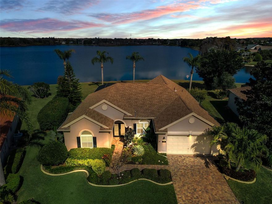 One or more photo(s) has been virtually staged. This is a rare opportunity to own a true lakefront gem on one of the largest lots in the gated Fox Wood community. This 3 bedroom, 2 bath residence offers 2,082 sq ft of beautifully designed living space with breathtaking water views and exceptional outdoor living. The oversized lot and premium lakefront setting create a truly special property that is seldom available. A lovely leaded glass front door welcomes you into the spacious Living and Dining Rooms featuring elegant crown molding and new wood flooring.
The gourmet Kitchen features Brazilian granite countertops, center island, premium stainless-steel appliances, vented Jenn-Air range, 42" custom cherry cabinetry, abundant pull-out storage, and a large eat-in area. The adjoining Family Room showcases rich hardwood flooring and sliders with plantation shutters that open to the outdoor living space.
The generous Primary Suite offers a sitting area, two walk-in closets, and a spa-like bath with dual sinks, granite counters, large garden tub, and water closet. The split floor plan includes two additional spacious bedrooms, ideal for guests, an office, or flex space.
Step outside to enjoy spectacular lake views from the in-ground pool with premium Diamond Brite finish and **new expansive screened lanai (2024)**, creating an ideal setting for both relaxing and entertaining. Additional upgrades include PGT hurricane impact windows (2024), Bahama hurricane shutters, hurricane-rated garage door, A/C replaced in 2020, new water softener, tankless water heater, double-pane insulated windows, and newer flooring.
Fox Wood offers private parks, playground, walking paths, and recreational areas, and is conveniently located near top-rated schools, shopping, dining, and all of Trinity’s best amenities. Make your appointment to see this one before it’s gone!