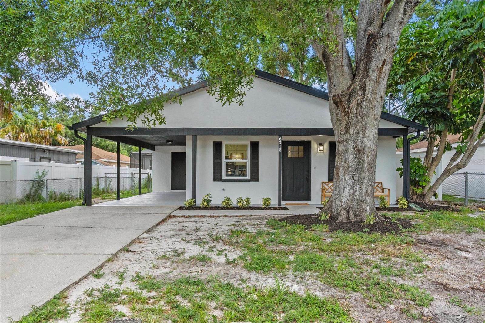Welcome to this beautifully remodeled 3-bedroom, 2-bathroom home, perfectly situated high and dry in the heart of vibrant South Tampa. This move-in ready residence offers stylish upgrades, modern comforts, and exceptional curb appeal.
Step inside to an open-concept living space filled with natural light from every angle. The spacious living and dining area seamlessly connect to a stunning quartz peninsula kitchen, complete with brand-new stainless steel appliances—including the refrigerator, oven, microwave, dishwasher, and sink.
The oversized primary suite features dual closets and a luxurious en-suite bathroom adorned with a deep navy tile shower and updated fixtures and vanity. Two additional guest bedrooms share a beautifully designed full bath with a light blue herringbone tile shower/tub combo, adding a touch of personality and charm.
An extended driveway leads to an oversized carport, offering plenty of parking. Just off the kitchen, the dedicated utility room adds convenience and extra storage. Out back, enjoy a fully fenced yard with mature trees, fresh mulch, and plenty of space to relax or entertain.
Recent major upgrades include a brand-new HVAC system (2025), new water heater (2025), and a roof installed in 2019—offering peace of mind for years to come.
Located just minutes from MacDill Air Force Base, Robinson High School, restaurants, shopping, and everything else South Tampa has to offer, this home combines modern living with an unbeatable location. Don’t miss your chance to own in one of Tampa’s most desirable neighborhoods!