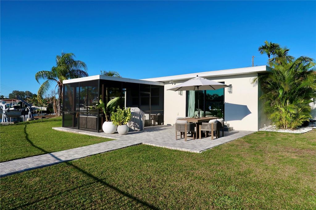 Photo of 9484 Treasure Lane NE, St Petersburg, FL 33702 (MLS # TB8486014)