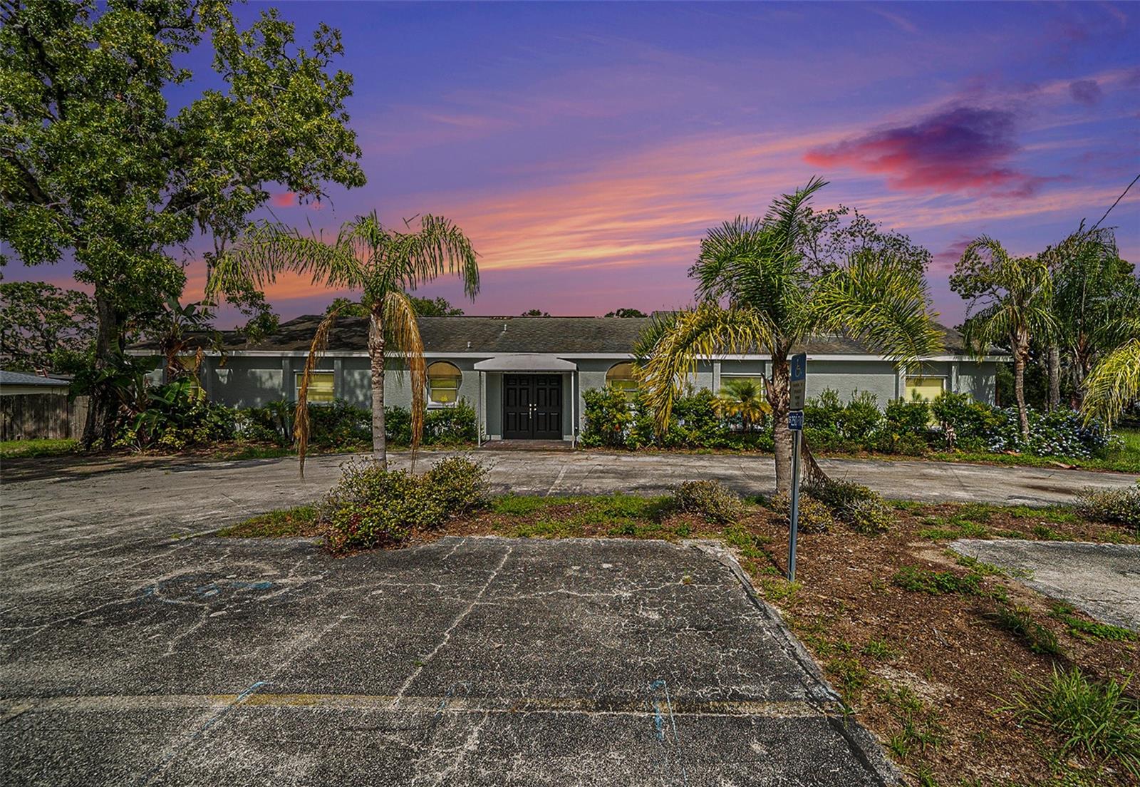 Fully renovated and move-in ready, this spacious 6-bedroom, 3 1/2 bath home sits on nearly 2 private, tree-lined acres in New Port Richey. Offering over 2,500 sq ft of updated living space, the home features generously sized bedrooms, modern finishes. Recent renovations include updated kitchen and baths, new flooring, and fresh paint throughout. Enjoy the tranquility of mature oak trees, ample outdoor space, and plenty of parking—all with no HOA. This one-of-a-kind property offers peaceful residential living with room to grow and customize.