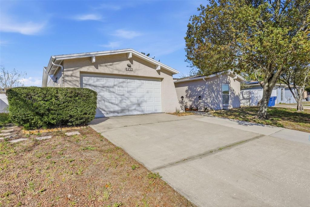 Photo of 8233 Redfield Drive, Port Richey, FL 34668 (MLS # TB8471236)