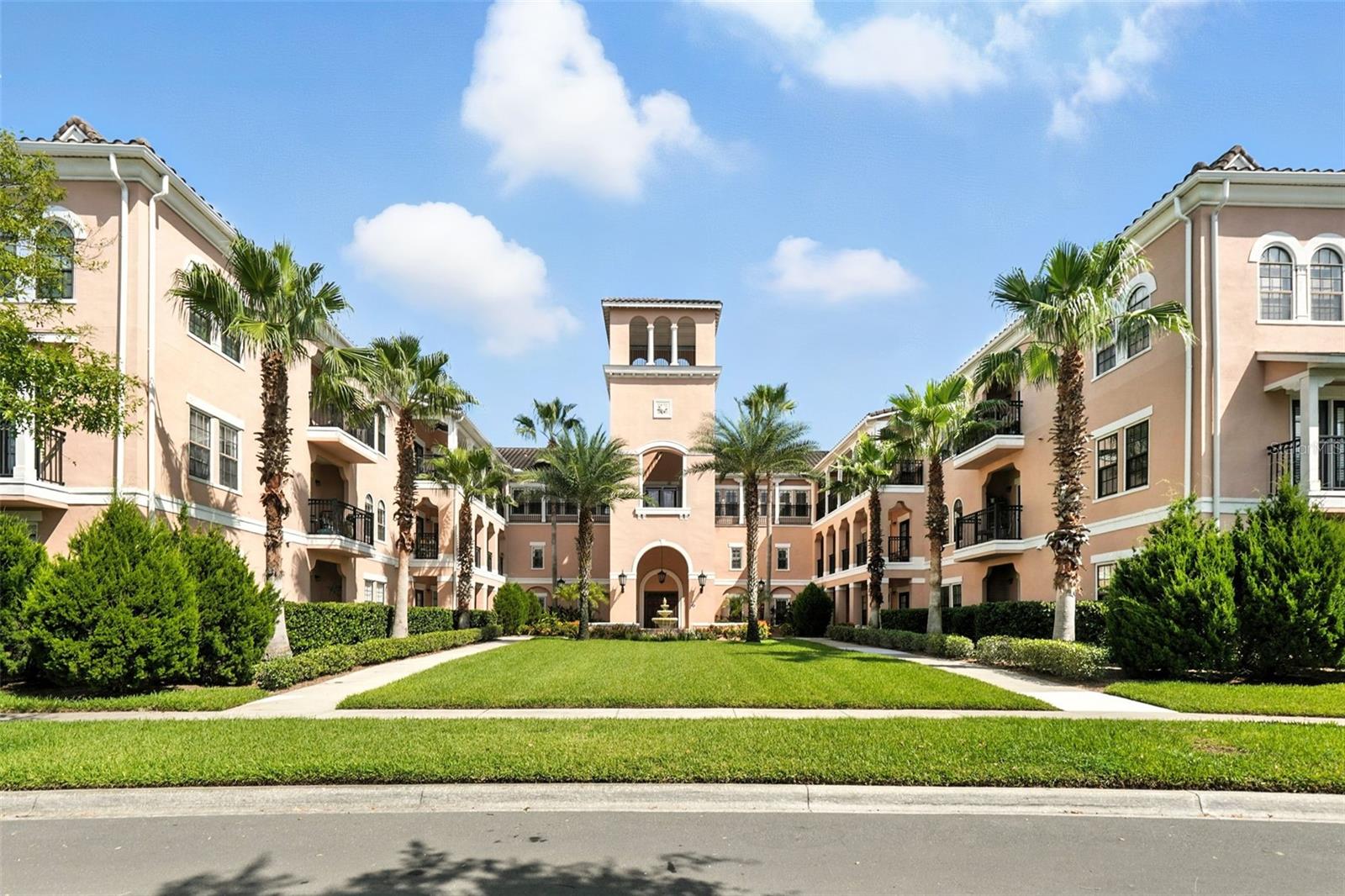 Located in an (enclosed) ELEVATOR building in Georgetown Celebration! New luxury vinyl tile throughout the condo with the exception of the kitchen and bathrooms which have ceramic tile. The interior of this condo was freshly painted within the last two years and new lighting fixtures were added throughout. As you enter this unit, you will find a foyer that provides room for you to hang your bags and take off your shoes. The recently updated kitchen features new stainless-steel appliances, epoxy countertops, and professionally refinished wood cabinets. The redesigned counter height bar makes it the perfect spot to prep food or sit for a quick meal. The kitchen flows directly into the spacious family room. The architecturally pleasing arched windows in this room cast beautiful light which brightens the entire living area throughout the day. On the back wall of this room there are two arched pass throughs into the dining area that mirror the same shape as the exterior windows. The arched pass throughs open the formal dining area into the main living space. These three rooms are adequately sized and open to each other offering a comfortable entertainment area for you to host friends and family. As if that wasn’t enough, the dining area has French doors that open up onto a scenic balcony. Imagine sipping your morning coffee out here as you listen to the morning birds sing. From the main living area, you’ll find a hallway with an office nook. It is the perfect spot to work from home with ample space for a desk and some shelving. The primary bedroom features a large walk-in closet and its own private bathroom. The second bedroom is also spacious with a door that enters directly into the bathroom as well as one that opens to the hallway for guests. Each bathroom features updates which includes 2 new toilets while the bedrooms feature new Hunter Douglas, custom pleated shades. Georgetown in North Village is a highly sought after condo complex since it offers its own clubhouse with workout room and private pool. No need to leave the comfort of this home to do laundry. The new full-sized washer and dryer are right inside this unit. Whether you are looking for a place to escape from the northern winters or need a year-round residence, this condo located in Disney's Town of Celebration is the place to start! It is conveniently located close to major highways, golf, restaurants and Central Florida’s theme parks. Live the CELEBRATION Lifestyle! (NEW A/C in 2025)