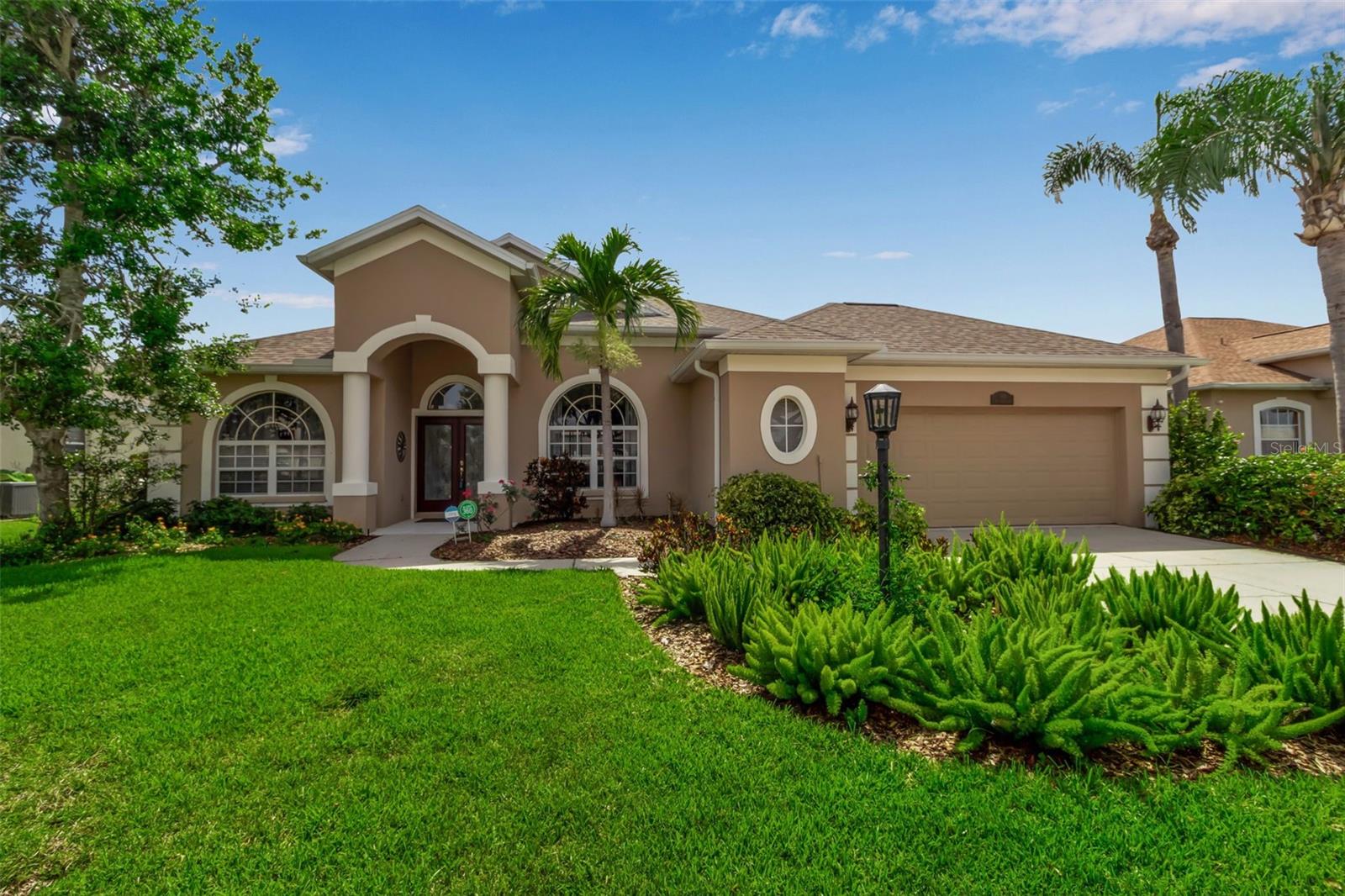 Welcome to this meticulously maintained home in the Greenfield Plantation/Planters Manor community, where timeless elegance meets modern comfort. Boasting 2,296 square feet of thoughtfully designed living space, this 3-bedroom, 2-bathroom residence includes a Bonus Room with a murphy bed, soaring 10’ ceilings, crown molding, and an open layout providing loads of natural light, perfect for both everyday living and entertaining. You will fall in love with the spacious redesigned and upgraded kitchen, featuring newer appliances, maple cabinets with plenty of storage and adjacent upgraded large mudroom. The private, gas-heated pool with waterfall and spa, added in 2011 and
nestled under a full screen enclosure is the perfect oasis for relaxation or year-round
outdoor fun.
The list of upgrades goes on and on:
• Roof (2020)
• Hurricane-rated garage door (2017) + new opener system/rails (2025)
• A/C with UV purification system &
• new attic insulation (2025)
• Water heater (2021)
• Updated guest bathroom, double vanity in master bathroom
• Tile & laminate flooring throughout
• Central vacuum system
• Security System
• Energy Efficient VFD pool pump system
• 2.5 gar garage with large freezer
• upgraded irrigation system
Low HOA $$, no CDD
This home is connected to Manatee County water/sewer, with natural gas service
(dryer, stove, heater/water heater, pool/ spa heater, grill), and has high speed internet.
Greenfield Plantation subdivision, with public golf course, is located near top-rated
schools (very close proximity to elementary and middle school), shopping, dining,
beaches, parks, and everyday conveniences — this is Florida living at its finest in a
community known for its charm and easy access to all that Manatee County has to offer.