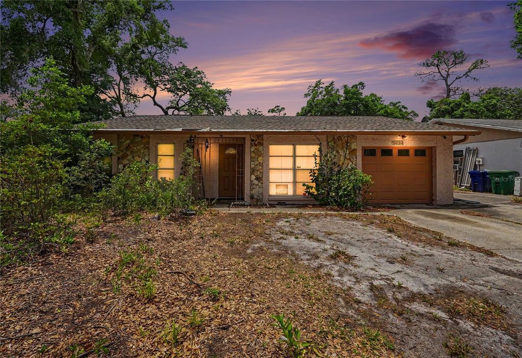 Photo of 9624 Hidden Oaks Circle, Tampa, FL 33612 (MLS # TB8505295)