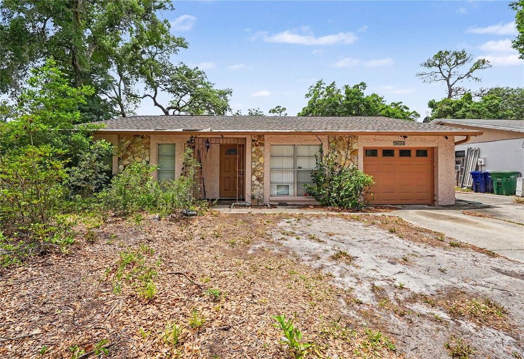 Photo of 9624 Hidden Oaks Circle, Tampa, FL 33612 (MLS # TB8505295)
