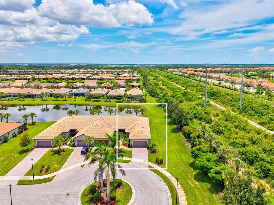 Loaded with upgrades, aggressively priced, and privately positioned at the end of a quiet cul-de-sac with no neighbor on one side, this end-unit Cascadia Villa is one of the best opportunities currently available in IslandWalk at the West Villages. Featuring a large extended lanai, desirable southern exposure, and long lake views, this home truly stands out from the competition.

Offering 2 bedrooms, 2 bathrooms, a den/office easily utilized as a third bedroom, and a spacious 2-car garage, the thoughtfully designed split-bedroom floor plan provides the comfort and privacy of a single-family home with the ease of low-maintenance villa living. Natural light pours throughout the open-concept layout, creating a bright and inviting atmosphere.

The upgraded kitchen showcases white linen wood cabinetry, custom quartz countertops and backsplash, extended cabinetry for additional storage and prep space, matching stainless steel appliances, and stylish pendant lighting. The spacious primary suite overlooks the water and features dual granite vanities, a frameless glass walk-in shower, and a large walk-in closet. Guests will appreciate the privacy of the separate guest suite and bath located on the opposite side of the home. French doors lead into the versatile den/office space, ideal for a home office, media room, or third bedroom.BRAND-NEW carpet has recently been installed in the bedrooms and den.

Additional upgrades include epoxy garage flooring with overhead storage, 5½-inch baseboards, crown molding, recessed lighting, plantation shutters, and laundry room cabinetry. Step outside to the oversized extended paver lanai, complete with a privacy shade and tranquil lake views, the perfect setting for relaxing mornings or spectacular Florida sunsets. Southern rear exposure provides abundant natural light throughout the day.

Residents of IslandWalk at the West Villages enjoy an unmatched resort lifestyle with two clubhouses, a resort event center, two resort-style pools, lap pool, 12 pickleball courts, 8 Har-Tru tennis courts, basketball court, dog park, playground, community garden, and miles of walking, biking, and golf cart trails. Two full-time activity directors coordinate events and activities year-round.

Conveniently located near Wellen Park, CoolToday Park, downtown Venice, Gulf beaches, shopping, dining, and the new Costco Wholesale, this home offers the ultimate Florida lifestyle. Not located in a flood zone, with a low CDD fee and HOA coverage that includes landscaping, irrigation, cable, Wi-Fi, resort amenities, and 24-hour guard-gated security, this is a rare opportunity to own an upgraded, move-in-ready home in one of Venice’s premier communities.