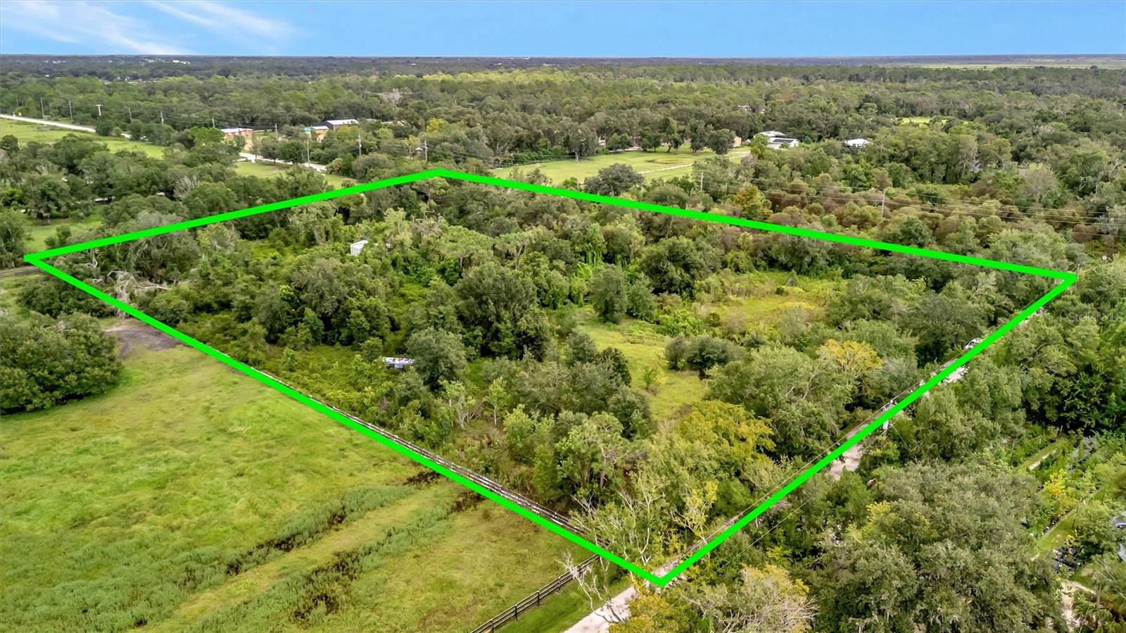 A rare opportunity, as this land has been in the family for decades. This over 5 acre parcel in Sarasota County is surrounded by mature trees and natural Florida landscape. It is the blank slate to create your dream estate, equestrian retreat, or private family compound.
Situated on a corner location with paved road access, the lot provides ample space for a custom residence, outbuildings, or agricultural use—all while maintaining the peace and quiet of country living. Despite its tranquil setting, the property is conveniently located within minutes of shopping, dining, and easy access to I-75, making travel to Sarasota, Venice, or Lakewood Ranch simple and stress-free.
With no subdivision restrictions and over 5 acres, zoned X (the lowest risk of flooding), the possibilities here are endless. Build the lifestyle you’ve been waiting for—whether that’s a spacious modern home, a working farm, or a serene retreat surrounded by nature.
There isn't an address. The parcel is East on Fruitville until the road T's. Head South (turn right) onto Myakka Road. Corner lot on the East side at Whidden and Myakka Road.