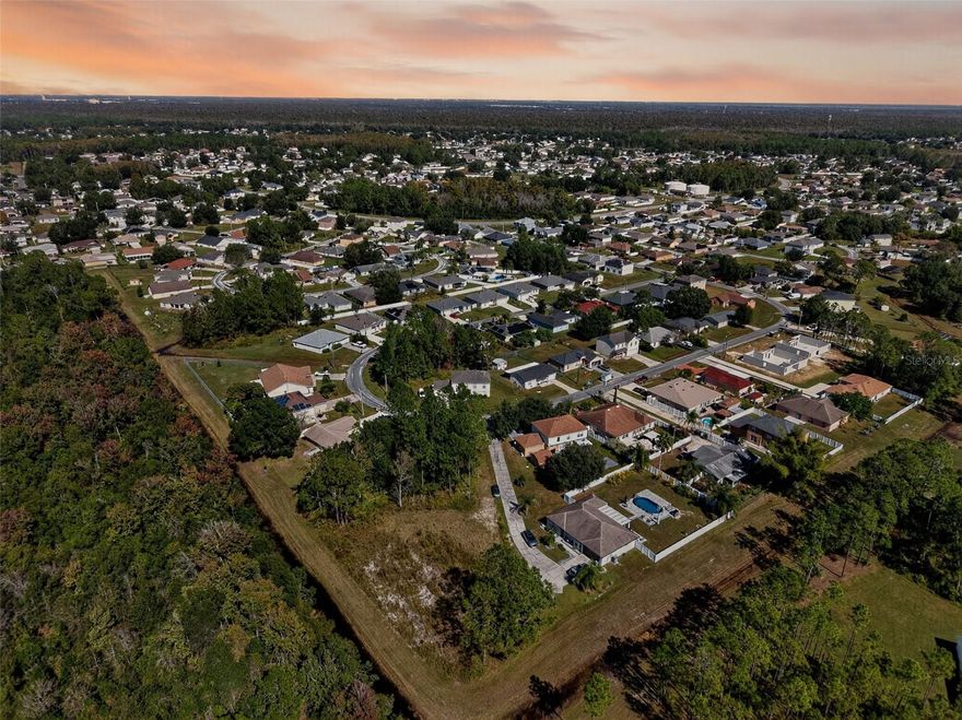 Bring your vision to life and build the home you’ve always dreamed of on this spacious 0.38-acre flag lot — fully cleared, leveled, and ready for your custom build.

Ideally located just 2 miles from the toll road on-ramp off Marigold Avenue, this lot offers a perfect balance of convenience and privacy, making your daily commute a breeze. You’ll also be close to many local amenities, including the Poinciana Medical Center (about 4.5 miles away), which has continued to expand since opening in 2013, and the Mary Jane Arrington Gym and Aquatic Center, located roughly 5 miles away.

That 16,000-square-foot facility features a full gym, fitness rooms, locker rooms, meeting spaces, a kitchen, and outdoor amenities such as a fitness trail, multi-purpose lawn, pavilion, and pool with diving boards and lap lanes. Just 5.4 miles away, the Community Activity Center Campus offers even more recreation, including a community pool and a recently remodeled fitness center.

With its cleared, level terrain, prime location, and access to top-tier community amenities, this property is the perfect canvas to design and build your dream home from the ground up.

Schedule a visit today to explore the incredible potential this beautiful lot has to offer!