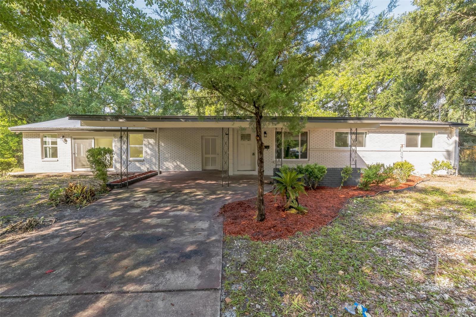 One or more photo(s) has been virtually staged. Newly Renovated 4-Bedroom Home with Workshop. Welcome to this beautifully renovated residence nestled on a quiet cul-de-sac in the heart of Jacksonville. This spacious home offers four bedrooms and three full bathrooms, featuring a desirable split floorplan that provides both privacy and functionality. With an oversized lot and no HOA, this property presents the perfect opportunity for those seeking space, freedom, and modern living.
Every detail of this home has been thoughtfully updated, including a brand-new roof, electrical system, HVAC, and energy-efficient windows. The interior and exterior have been freshly painted, and new flooring has been installed throughout, creating a clean and contemporary aesthetic. The completely remodeled kitchen is equipped with new cabinetry, granite countertops, and sleek LED lighting, making it the perfect space to gather and entertain.
The layout includes a spacious living room and a separate family room, ideal for use as a home office, playroom, or second entertainment area. The split-bedroom design ensures a comfortable flow and added privacy for guests or multigenerational living. Outside, the oversized backyard offers plenty of room for pets, recreation, or potential expansion, and includes a separate workshop ideal for hobbies, storage, or additional workspace.
This pet-friendly home is move-in ready and conveniently located close to schools, shopping, and major roadways. Don’t miss your chance to own a turnkey home with no HOA and endless possibilities. Schedule your private showing today.