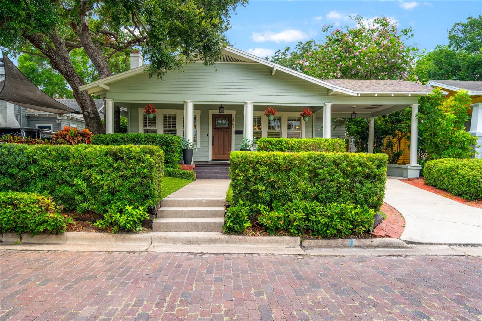 Nestled on a picturesque brick-lined street in the heart of coveted Palma Ceia, this beautifully maintained 4-bedroom, 2-bath bungalow seamlessly blends timeless charm with modern comfort. Keep your family safe in this HIGH & DRY, NO FLOOD ZONE residence. Featuring real wood flooring throughout, the home opens to spacious, sunlit living areas and an inviting layout perfect for both entertaining and everyday living. Step into a grand living room that gracefully opens into two inviting and intimate spaces. One corridor leads to two ground-floor bedrooms and a hall-access bathroom, offering comfort and convenience. The other corridor guides you into the formal dining room, where elegant wainscoting and upgraded lighting—complete with wall sconces and a statement chandelier—create a perfect setting for entertaining guests. From there, continue into the thoughtfully designed kitchen, featuring a breakfast bar and custom cabinetry ideal for displaying your finest stemware and china. But the true showstopper? A stunning set of triple glass doors that accordion open, seamlessly connecting the indoors to the pool area for effortless indoor-outdoor living.
Step outside to your private backyard retreat—complete with a sparkling pool (resurfaced 2017), relaxing hot tub (2017 Heater/2024 Filter/Pump), and a mosquito misting system for year-round enjoyment.
Ascend upstairs to a spacious primary retreat with a large walk-in closet and connected bathroom. Upstairs also offers the 4th bedroom - or can serve as an office or exercise room off of the primary suite.
Just minutes from the Palma Ceia Golf & Country Club, Palma Ceia Park (playground, basketball & dog park) and scenic Bayshore Boulevard (fitness trail), this home places you in the center of South Tampa’s most desirable lifestyle. Enjoy close access to Hyde Park Village, local dining, boutique shopping, and nearby playgrounds.