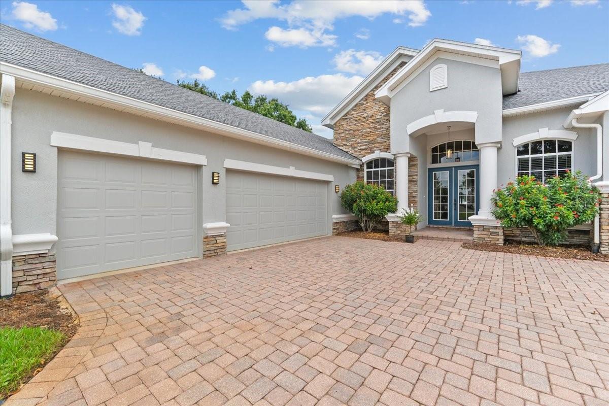 Welcome to this absolutely amazing 4 bedroom, 3 bathroom home that shows like a luxurious model home. Designed by Authur Rutenberg and build by Henderson Homes in 2005, it offers a spacious and open floor plan with countless high-end upgrades that make it extremely attractive. The interior has beautiful tile that flows throughout the The bright, open floor plan and main living areas have tile and crown molding. It is enhanced by upgraded lighting and modern ceiling fans, adding a touch of sophistication and comfort. The large gourmet and gas apliance kitchen features stainless-steel appliances, quartz counter tops, 42 inch cabinets and a spacious pantry. ALL APPLIANCES ARE INCLUDED. This home is perfect for entertaining guests and undoubtably this kitchen is sure to impress visitors. The owners suite is a luxury retreat, offering a spacious walk-in closet and a luxurious bathroom with upgraded luxury walk in shower, dual sinks, and a separate water closet for added privacy. The secondary bedrooms are generously sized and share second and third bathroom with upgraded fixtures. The covered, screened lanai with pool, hot tub, outdoor kitchen and fireplace provides ample space for outdoor living and entertaining. The beautifully landscaped lawn and fenced yard add great curb appeal and add to the beauty of this property. This exceptional home is move-in ready and offers comfort, style, and modern features in one package. Don't miss this opportunity!