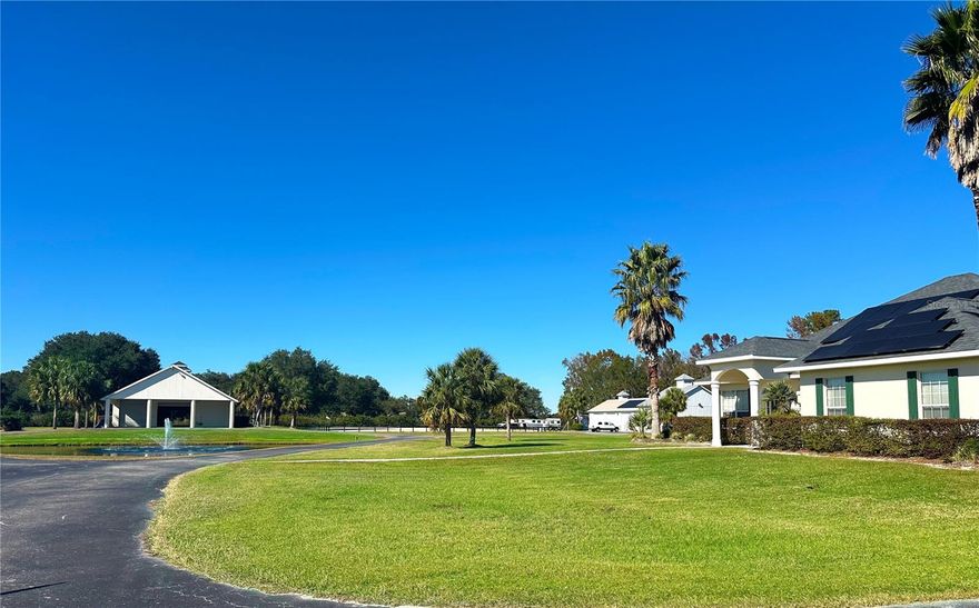 Nestled on a quiet road in NW Ocala, this 12-acre horse property is a rare find just 15 minutes from WEC and 12 minutes to HITS. Thoughtfully designed, it offers everything needed for equestrian living. The centerpiece is a 12-stall center-aisle CB barn, complete with tack and feed rooms, a laundry area, and a full bath. A 9-stall annex barn adds extra capacity, complemented by 13 paddocks and a riding arena for training and leisure. The 3-bedroom, 2-bath CB home is bright and well-appointed, featuring tile floors, granite countertops, and a covered porch with arena views. A 5-bay equipment building with RV hookups provides ample storage, while solar panels on the home and equipment building enhance energy efficiency. With curb appeal, functionality, and a prime location in Ocala's beloved farmland preservation area, this farm is a turnkey opportunity for the serious equestrian.