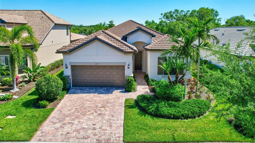 Imagine yourself in modern luxury living within the resort-style Hammock Preserve Community on Palmer Ranch!  This stunning 4-bedroom, 2-bathroom home built in 2020 with Impact Glass sliders and windows offers an oasis of security and comfort.  Unwind with expansive southern and private preserve views flowing seamlessly from the extended Great Room out onto the oversized screened lanai.  Soaring 11 ft. ceilings, an abundance of natural light and easy-care light-toned interior finishes set an ambiance for both relaxation and coastal entertainment. The chef’s kitchen features a gas stove, 42-inch high, light solid-wood cabinetry and stainless upgraded appliances.  Guests and Family gather around the Pearl Granite oversized kitchen island with overflow into the café seating, relaxing al fresco on the Lanai or gathering around the large dining center in the Great Room.  A luxurious primary suite with a spa-like ensuite bathroom features upgraded comfort-height cabinetry, granite countertops, dual sinks, a walk-in shower with frameless glass surround, and an oversized walk-in closet.  Plentiful storage is provided throughout the home and the extended 2-car garage is designed to house your lifestyle companions for golf, bicycling and/or water toys!  Enjoy peace of mind behind the community gates and embrace the resort-style living offered by the clubhouse, Barefoot Bar, heated pool & spa, and fitness center. Pickleball, tennis, bocce courts, a fire pit, fishing pier and onsite Property Manager round out the exceptional amenities. Furry-family members are welcome here and will enjoy the two-sided Dog Park for both large and small canines.   All this with easy access to Downtown Sarasota’s cultural center, charming Downtown Venice, the world-famous Siesta Key beach and the 20+ mile storied Legacy Trail.  Don’t miss your chance to own this piece of paradise!  Schedule a showing today!